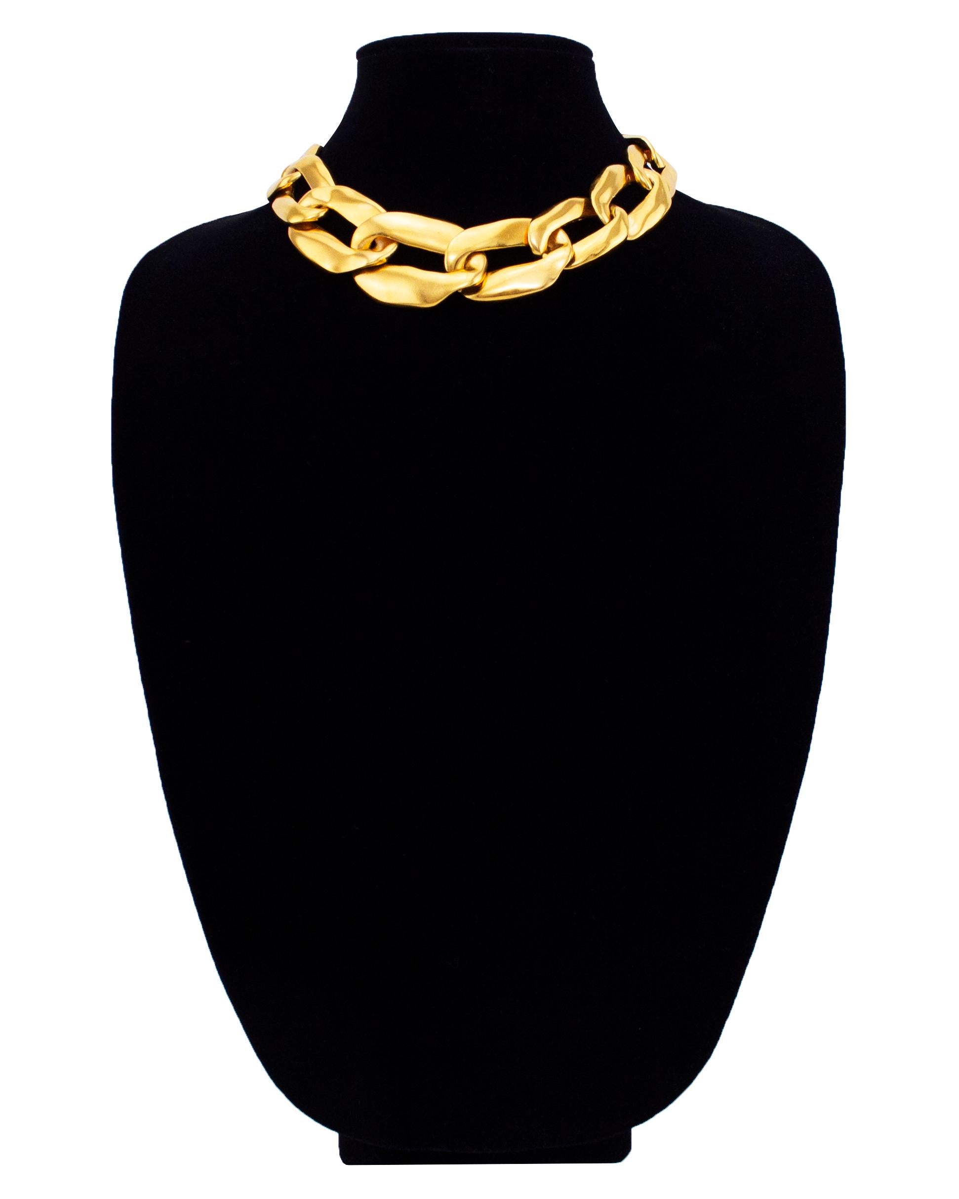 Mid 1980's YSL gilt metal oversized graduated chain link necklace. Adjustable at the back to fit loose or choker style. This is a classic piece of fashion jewelry that Yves Saint Laurent repeated every decade with slight variations. This version has