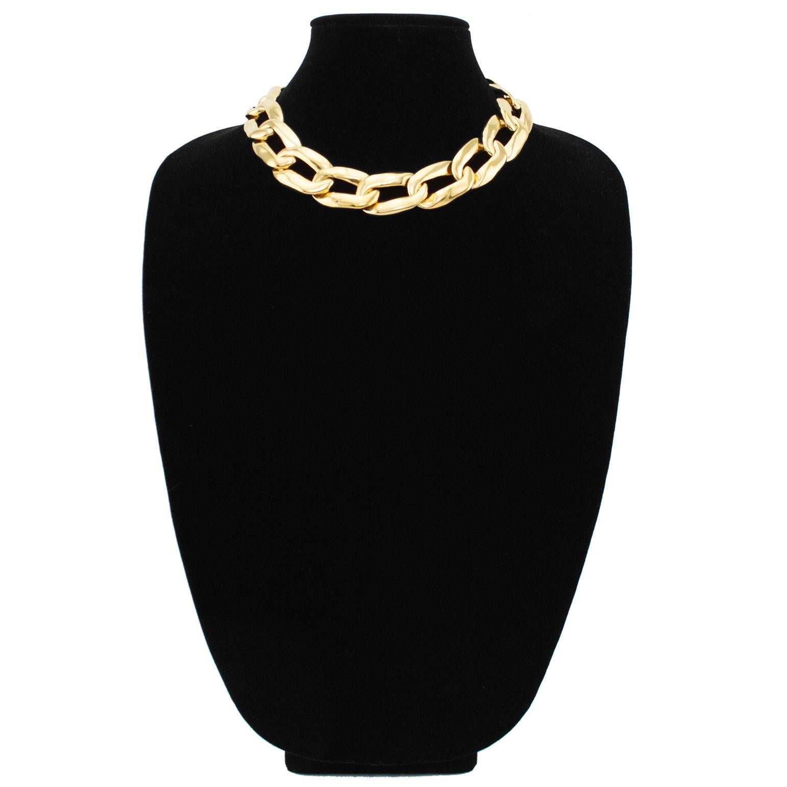 Mid 1980's YSL gilt metal oversized chain link necklace. Adjustable at the back to fit loose or choker style. This is a classic piece of fashion jewelry that Yves Saint Laurent repeated every decade with slight variations. This version has large