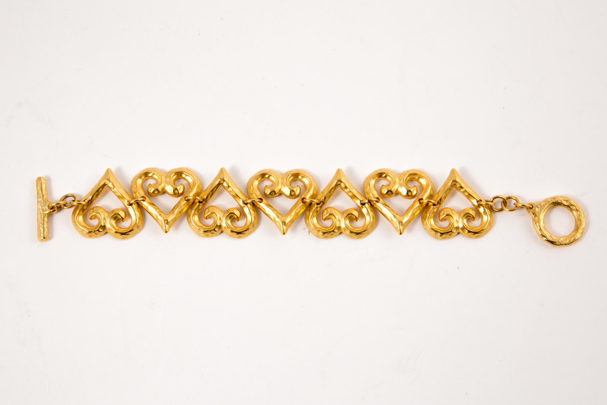 1980s Yves Saint Laurent gold tone chain bracelet featuring fancy hearts, a toggle closure with embossed YSL on. 
Length7.8in. (20cm)
In excellent vintage condition.  Made in France.
We guarantee you will receive this gorgeous earrings as described