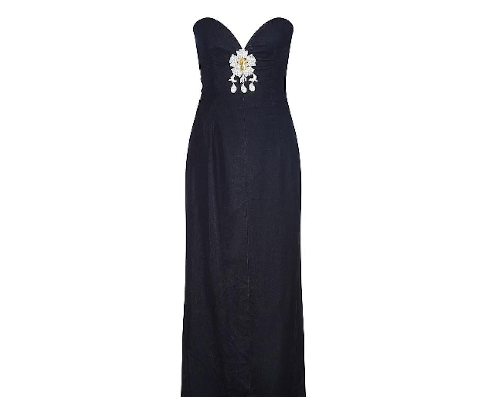 This is an exceptionally fine 1980s haute couture velvet column dress that features an elaborate stomacher jewel which is sewn into the sweetheart bodice.  The stomacher jewel features a very large faceted faux citrine stone with pave set diamantes