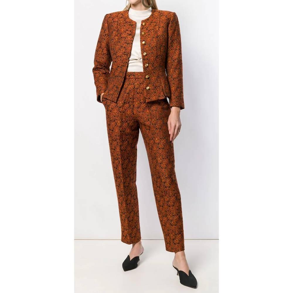Yves Saint Laurent jacquard wool suit with straight high waist trousers with belt loops, pleat on the front, welt pockets and front zip and hook closure; crew-neck jacket, single-breasted front closure with golden buttons and slightly