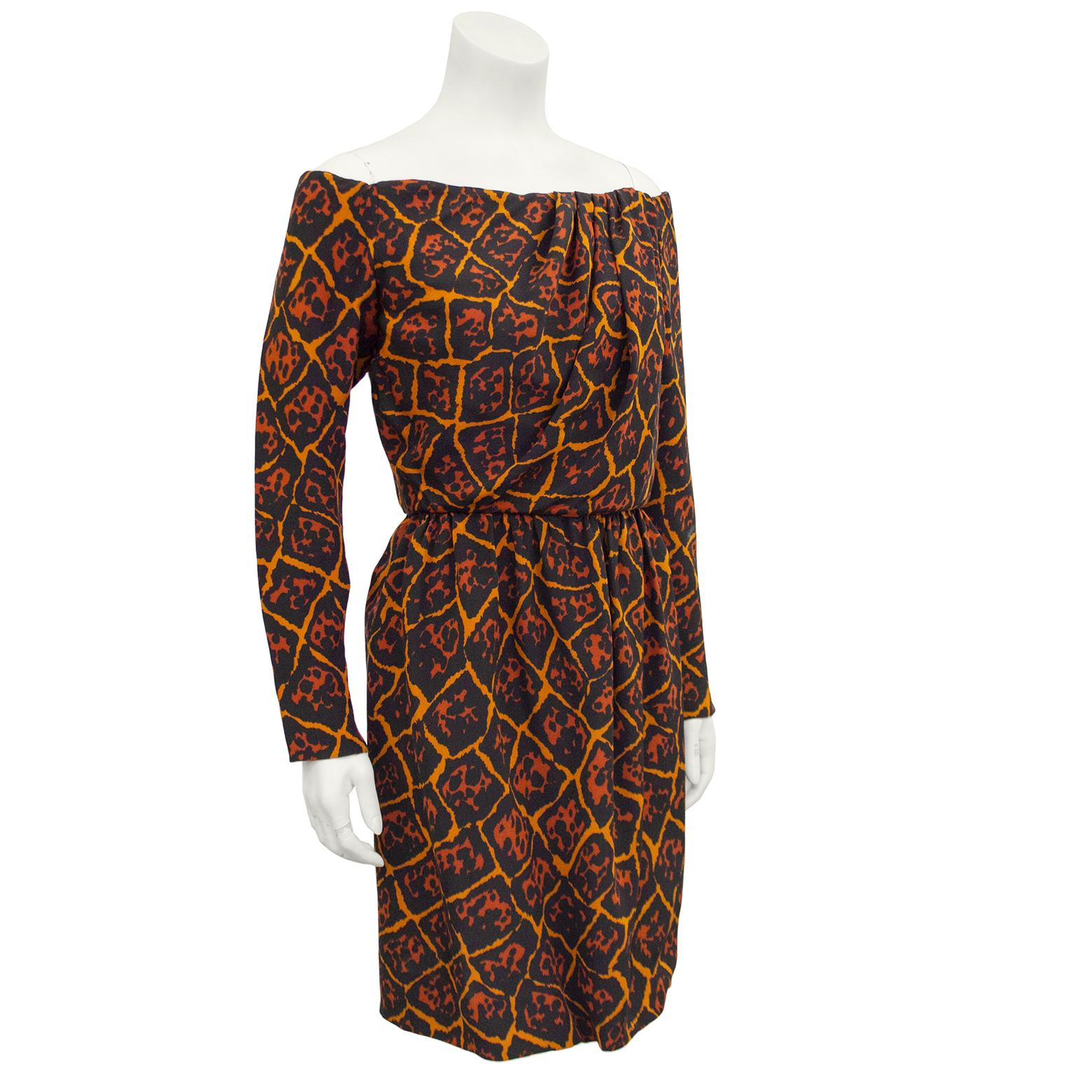 Yves Saint Laurent early 1980s orange, black and brick color allover leopard/giraffe fusion print crepe dress. Interior boning and corset with snap closures on left side when wearing. Off the shoulder & long sleeves with zippers at cuffs. Ruching