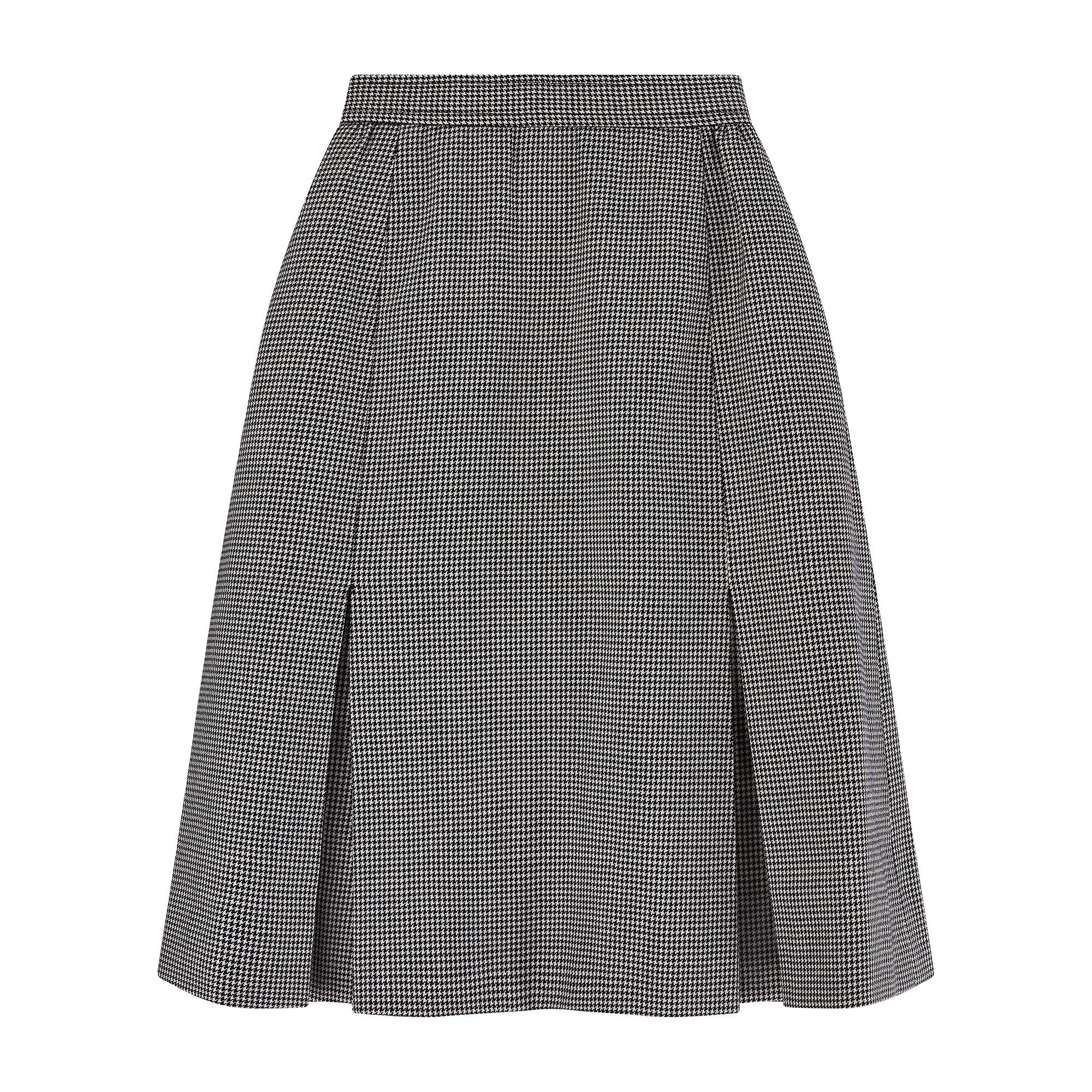 This elegant skirt was designed by French fashion house Yves Saint Laurent and is likely from the s/s 1983 collection where a similar design was shown as part of the runway presentation (pictured). The label reads “Saint Laurent Rive Gauche”, a