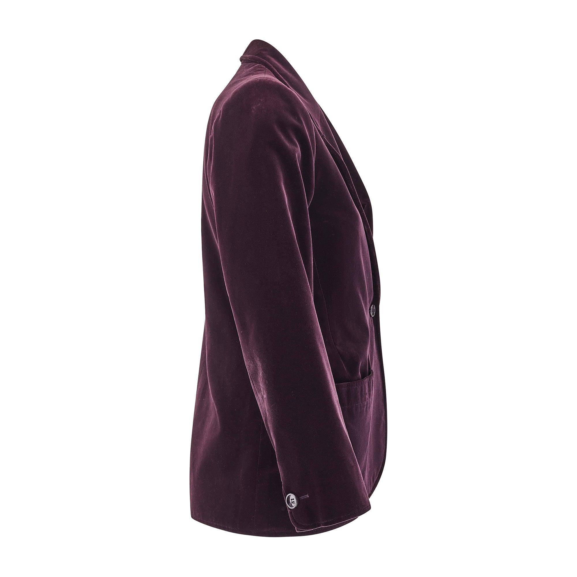 This elegant velvet jacket was designed by Yves Saint Laurent during the early 1980s and we have attached an editorial shoot of a very similar jacket from the Fall 1981/1982 collection. Made in France, it is crafted from smooth aubergine velvet. The