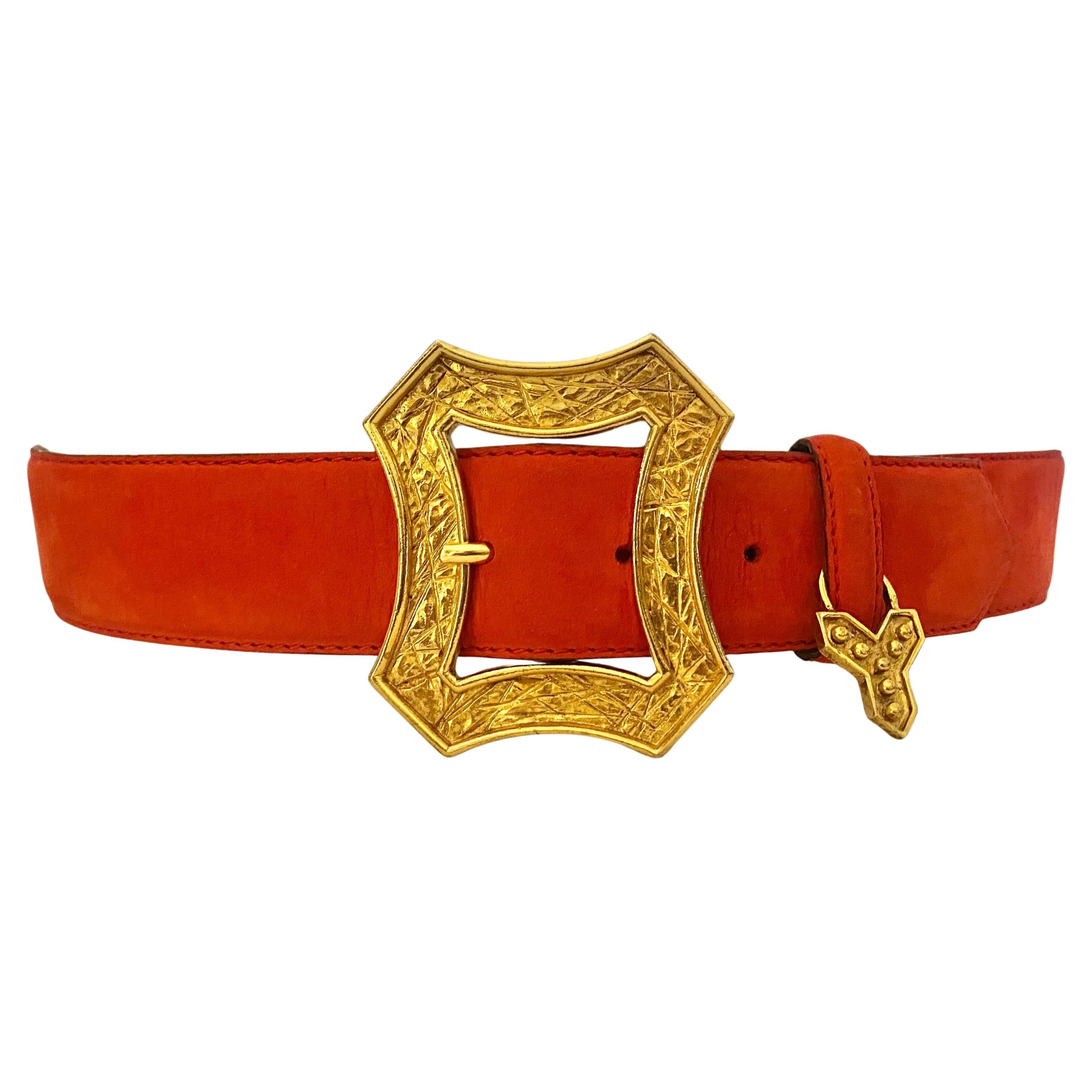 YSL's lobster-red suede leather belt is the perfect adornment for any ensemble, featuring a gold-tone metalware charm with the iconic Y initial, all crafted with luxurious precision in France.

Measurements: flat waist measurement 29-31