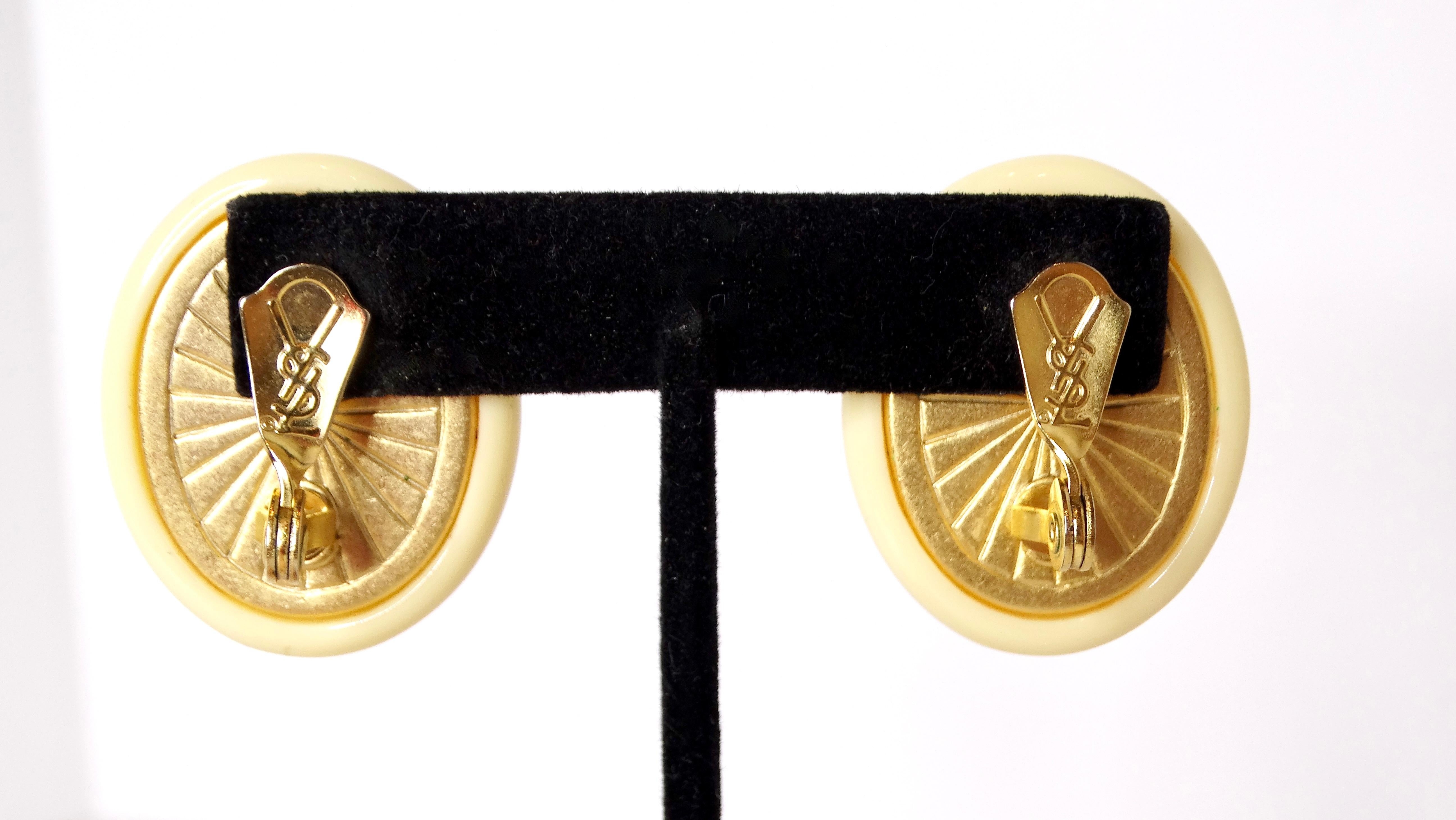 The 1980s Yves Saint Laurent Resin Costume Amber Cabochon Clip-On Earrings are a striking embodiment of the bold and innovative style that defined the era. These vintage earrings feature a creamy resin outer layer enveloping a stunning amber-colored