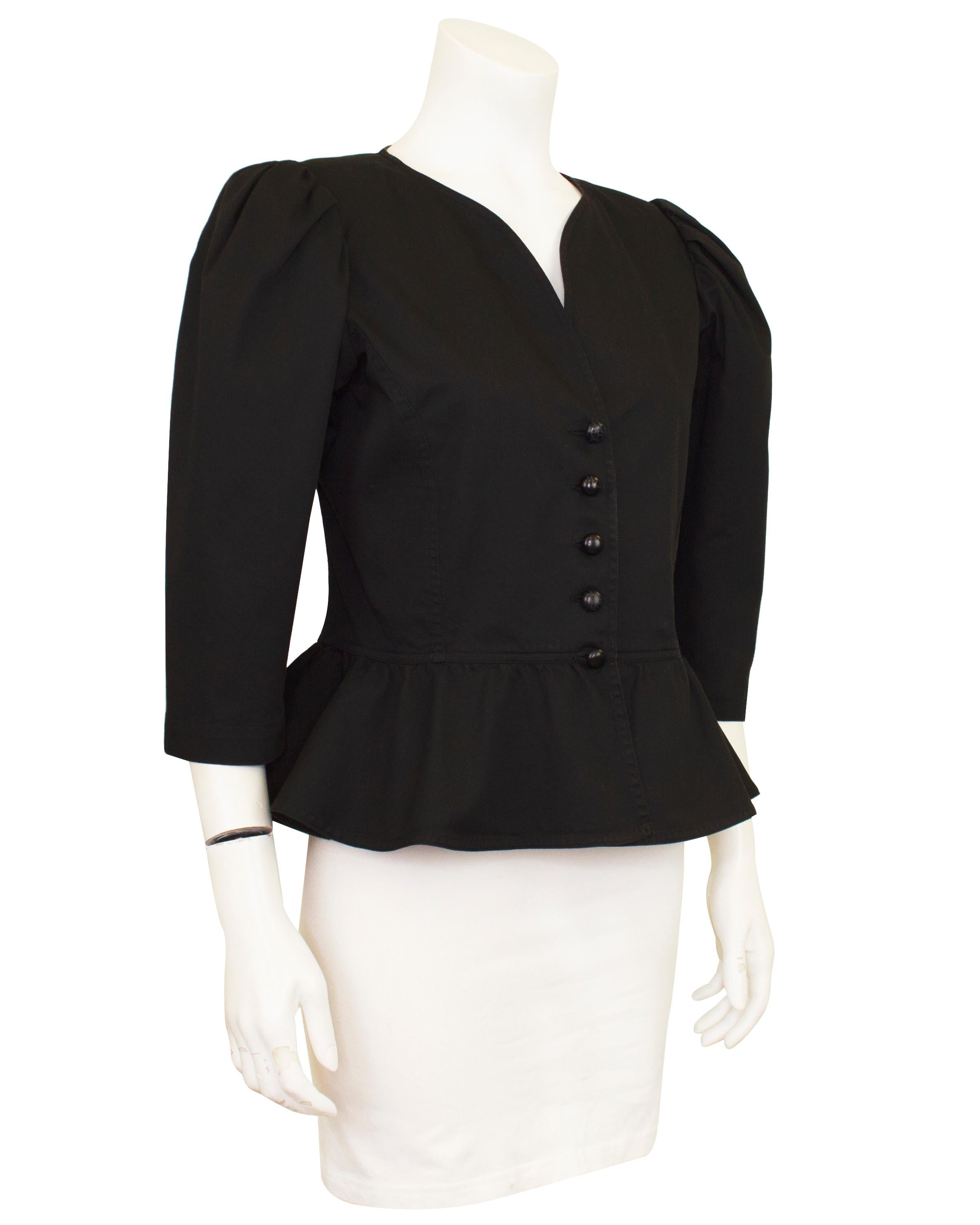 Amazing 1980s Yves Saint Laurent Rive Gauche light weight black cotton twill jacket. The jacket features a curved v neckline, leg of mutton sleeves and a peplum at the waist. Unlined. This is a great seasonally transitional piece that can be styled