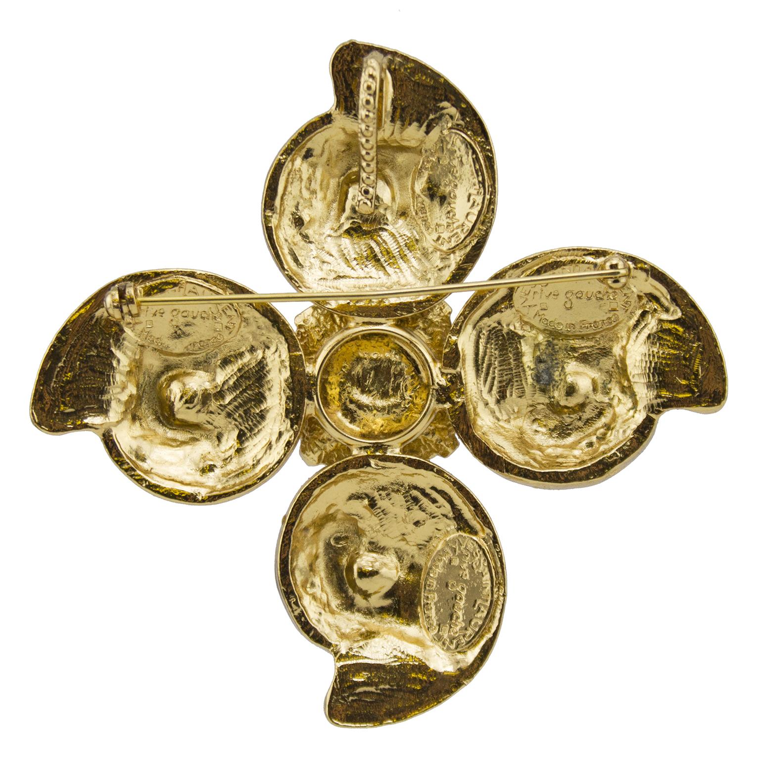 1980s Yves Saint Laurent Rive Gauche statement pin/pendant. Gold tone metal with a large cushion cut topaZ coloured glass stone in the centre. Four spiral shell-like details with alternating clear and topaz rhinestone embellishments that get