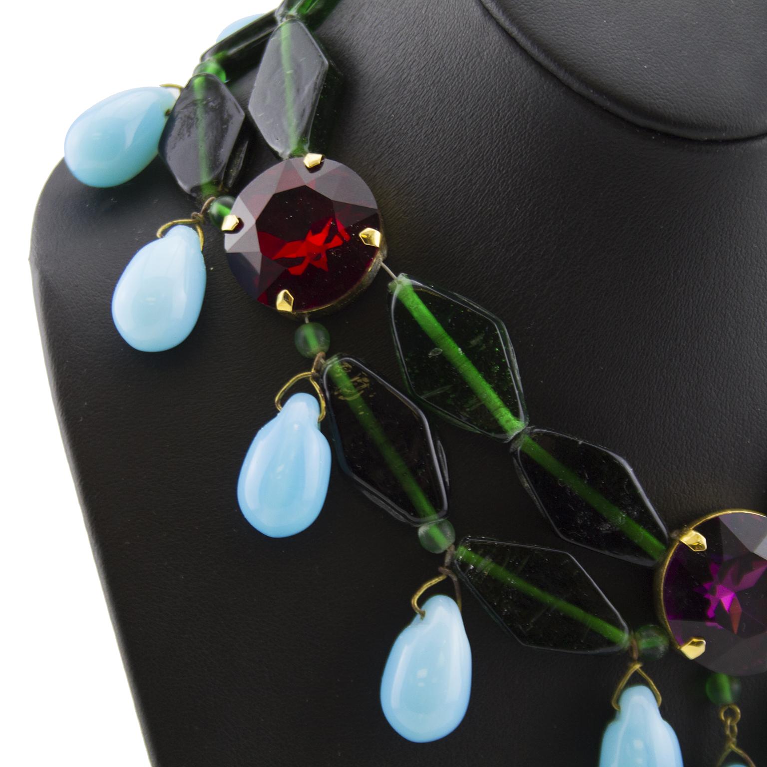 Stunning 1980s Yves Saint Laurent Rive Gauche Lou Lou de la Falaise era statement necklace. Green faceted glass diamond shaped beads with three large circular stones, two red and one purple. Turquoise tear drop shape beads hang throughout. Hook
