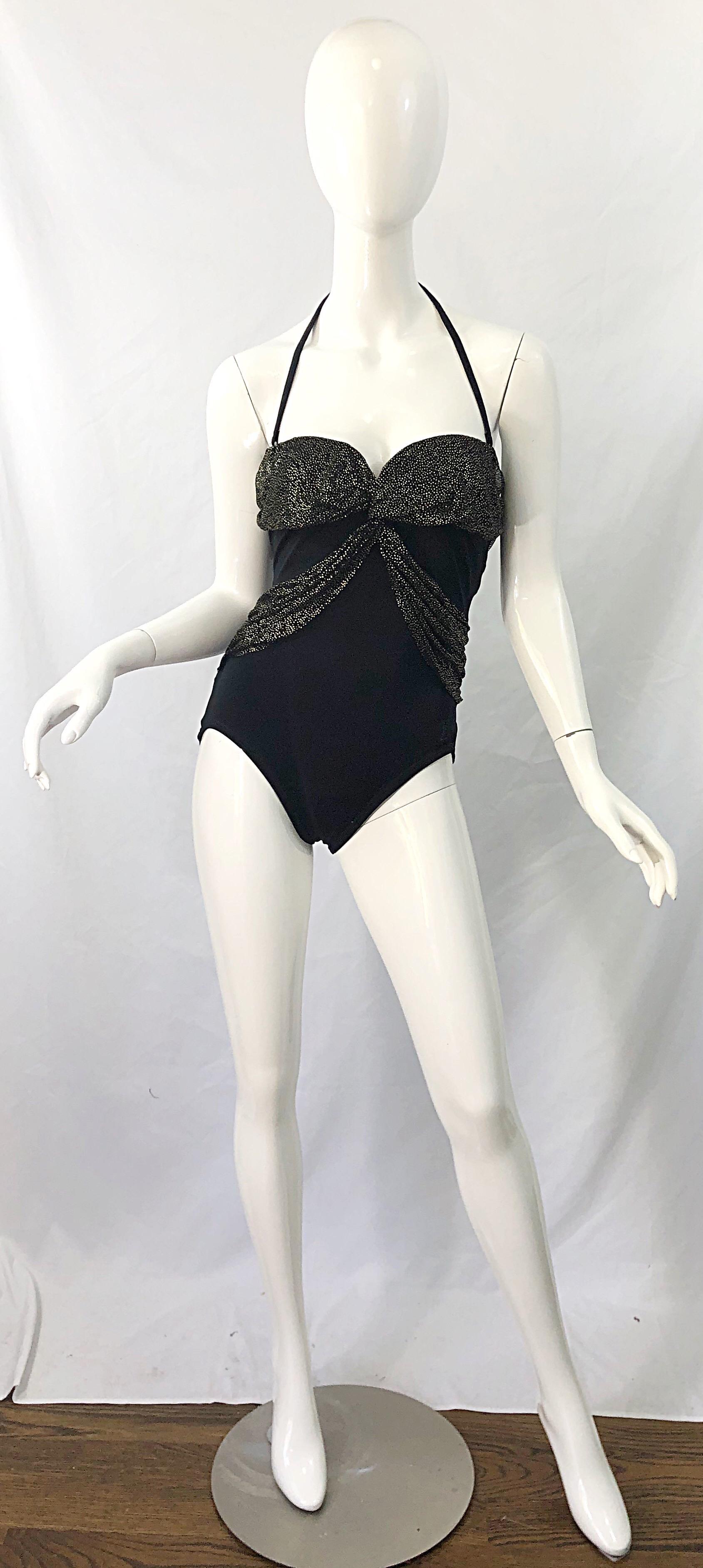 Sexy vintage early 80s YVES SAINT LAURENT black and gold convertible halter strap one piece swimsuit or bodysuit ! Features a black body with black and gold speckled mesh overlay at bust and side waist. Convertible halter straps can be easily