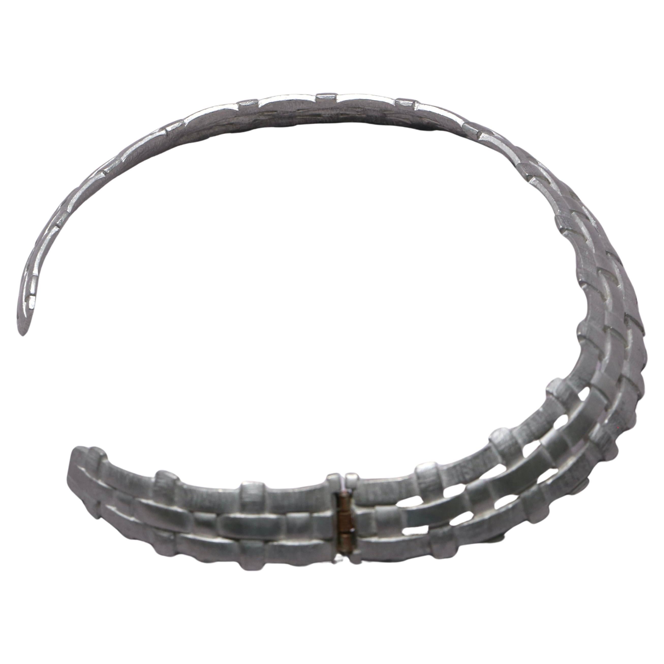 Women's or Men's 1980's YVES SAINT LAURENT 'woven' silver toned collar necklace with hinge For Sale