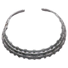 1980's YVES SAINT LAURENT 'woven' silver toned collar necklace with hinge