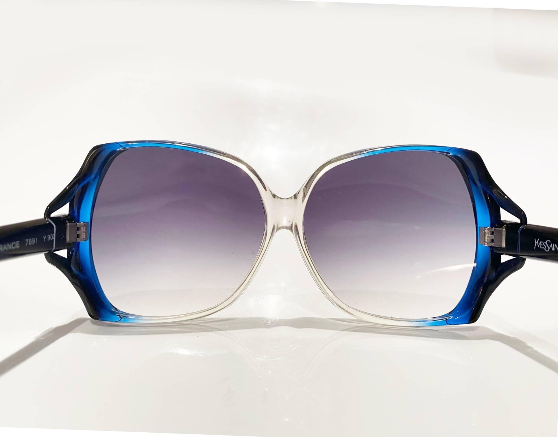 Yves Saint Laurent oversized sunglasses , blue clear, logo on black side tag,Made in France 

Condition: excellent 1980s vintage, original case included 

Measurements: 
- total width: 14.5cm / 5.7in
- bridge distance: 3cm / 1.8in
- lens height: 7cm