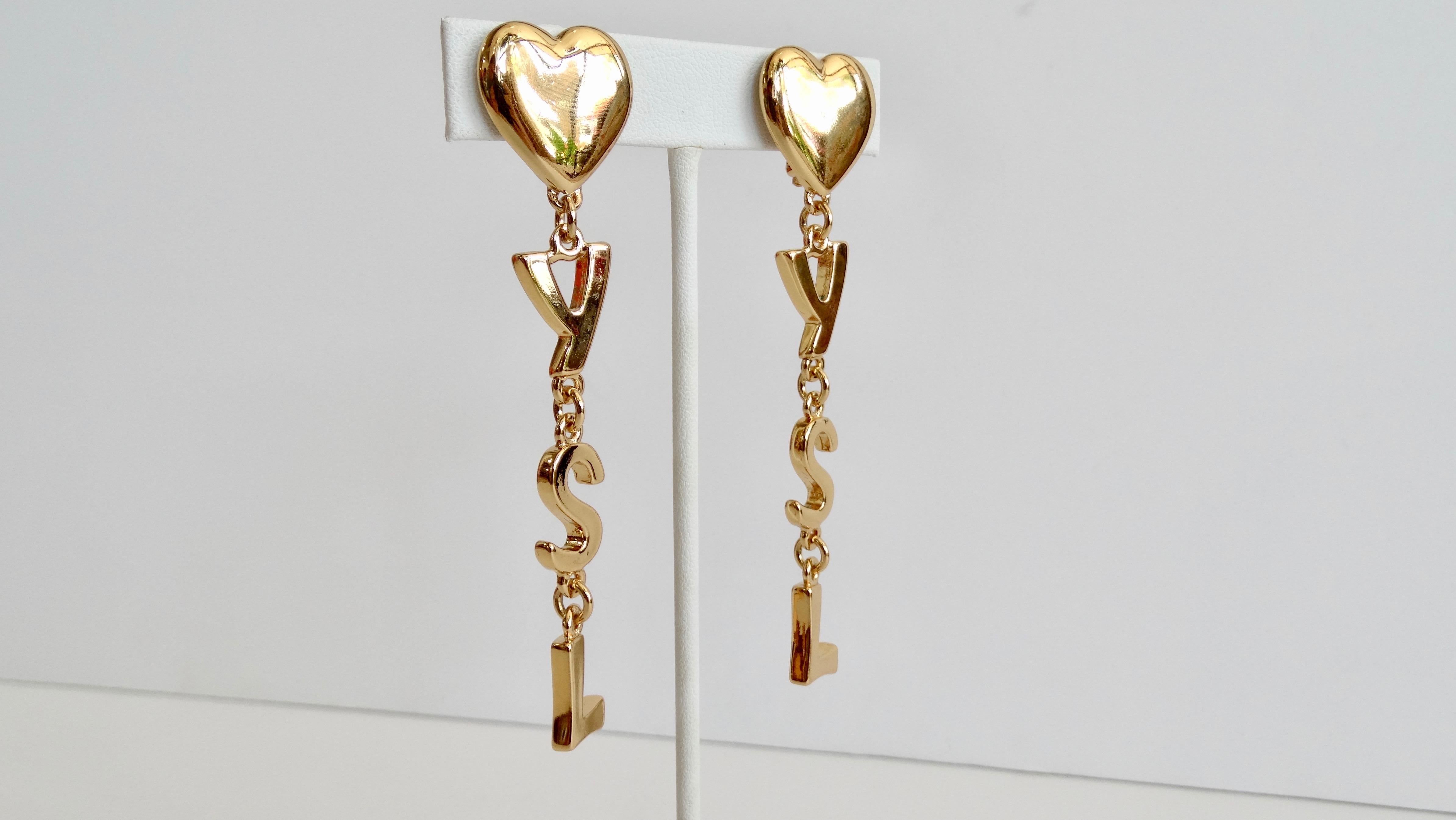 No one does eye candy like Yves Saint Laurent! Circa 1980s, these gold plated dangle earrings feature the iconic 