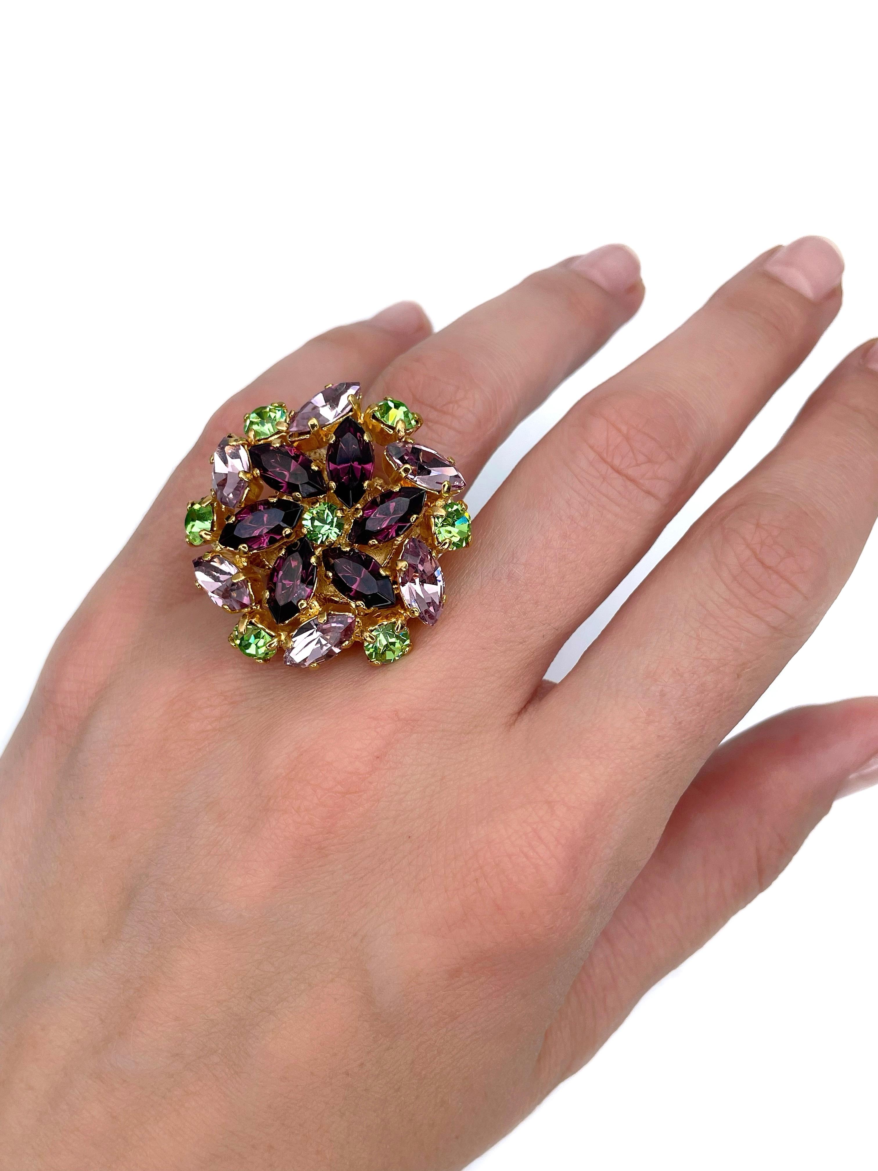 This is a stunning vintage floral cocktail ring designed by YSL in 1980s. The piece is crafted in gold tone metal. It features purple, green and pink shiny crystals. 

Signed: “Yves Saint Laurent. 5” (shown in photos).

Size: 16.25 (US 5.5)

———

If