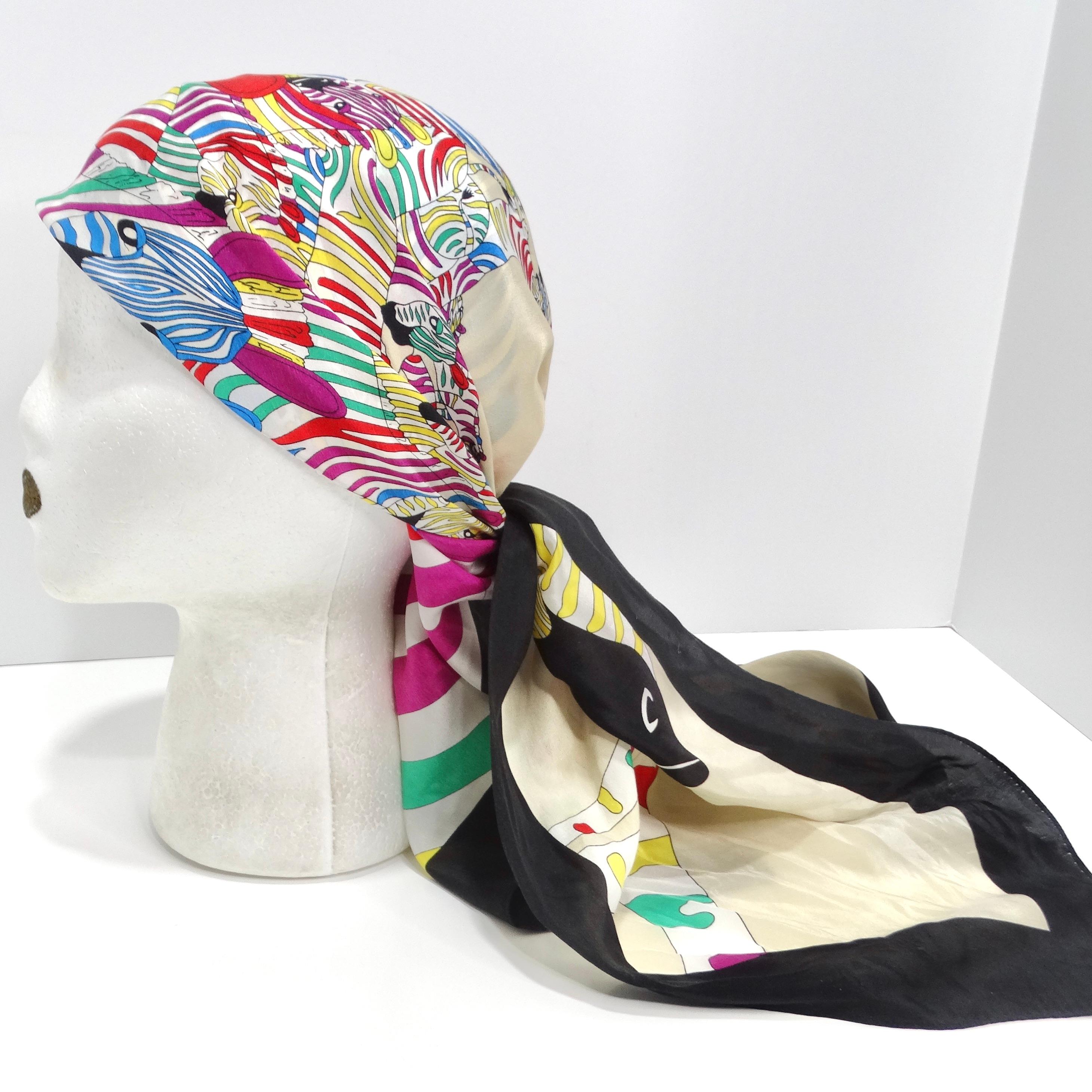 Introducing the 1980s Zebra Print Silk Scarf, a captivating and bold accessory that embodies the spirit of the 1980s with its vibrant design and eye-catching details. Crafted from luxurious ivory silk, this scarf features a striking zebra print