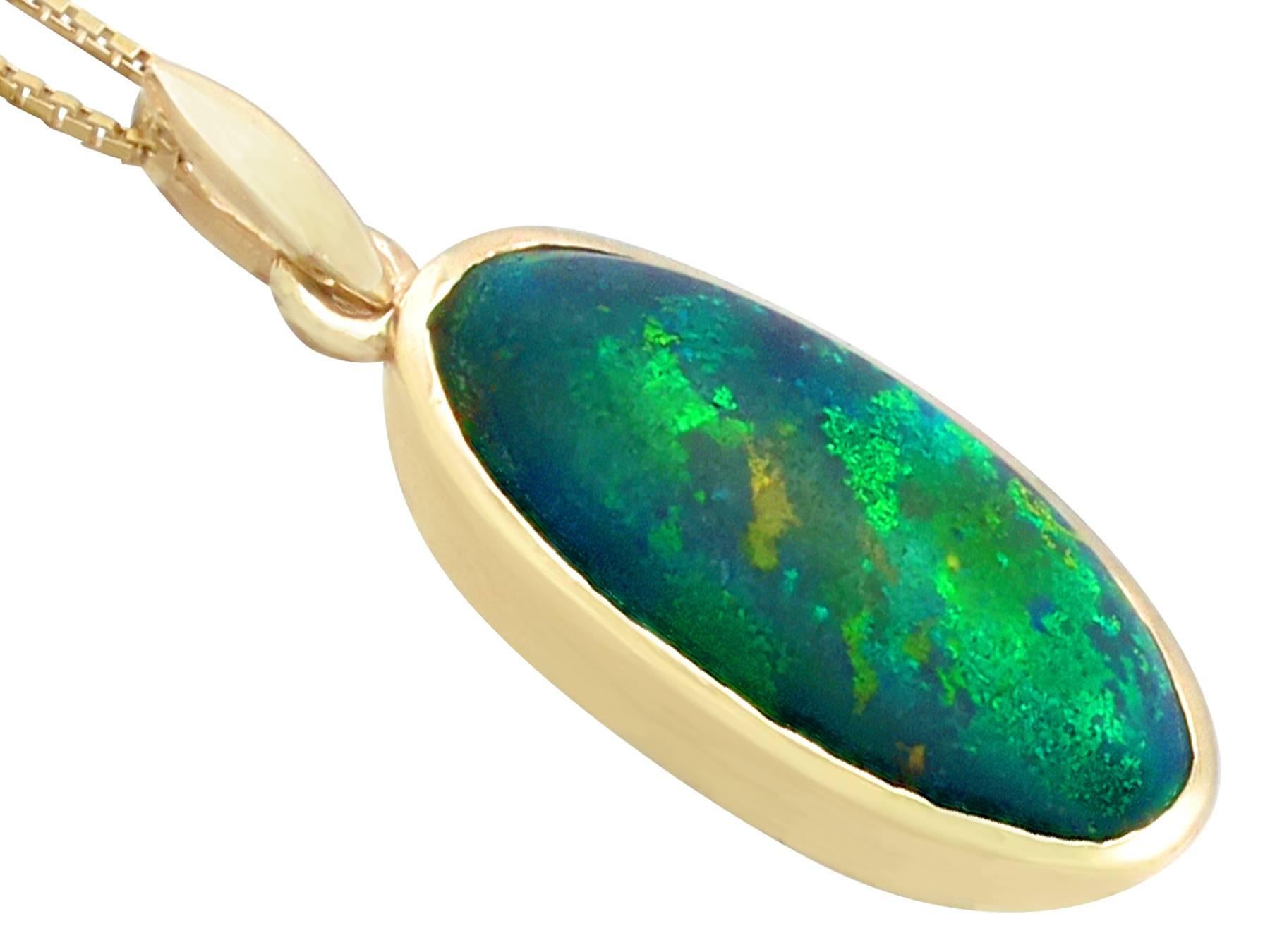 Cabochon 1981 3.82 Carat Black Opal and Yellow Gold Pendant (chain not included)