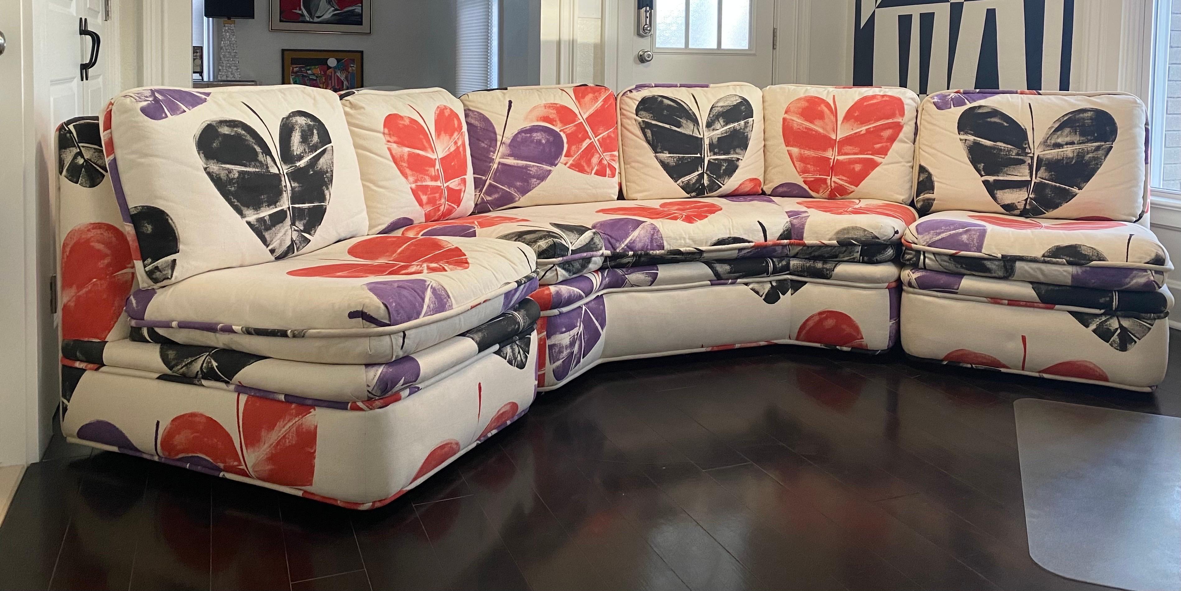 We are very pleased to offer a beautiful, whimsical sofa by Baker Furniture, circa 1981. Showcasing its original playful, linen fabric, this piece offers a visual conversation of beautiful, heart-shaped leaves in red, black and purple colors. Each
