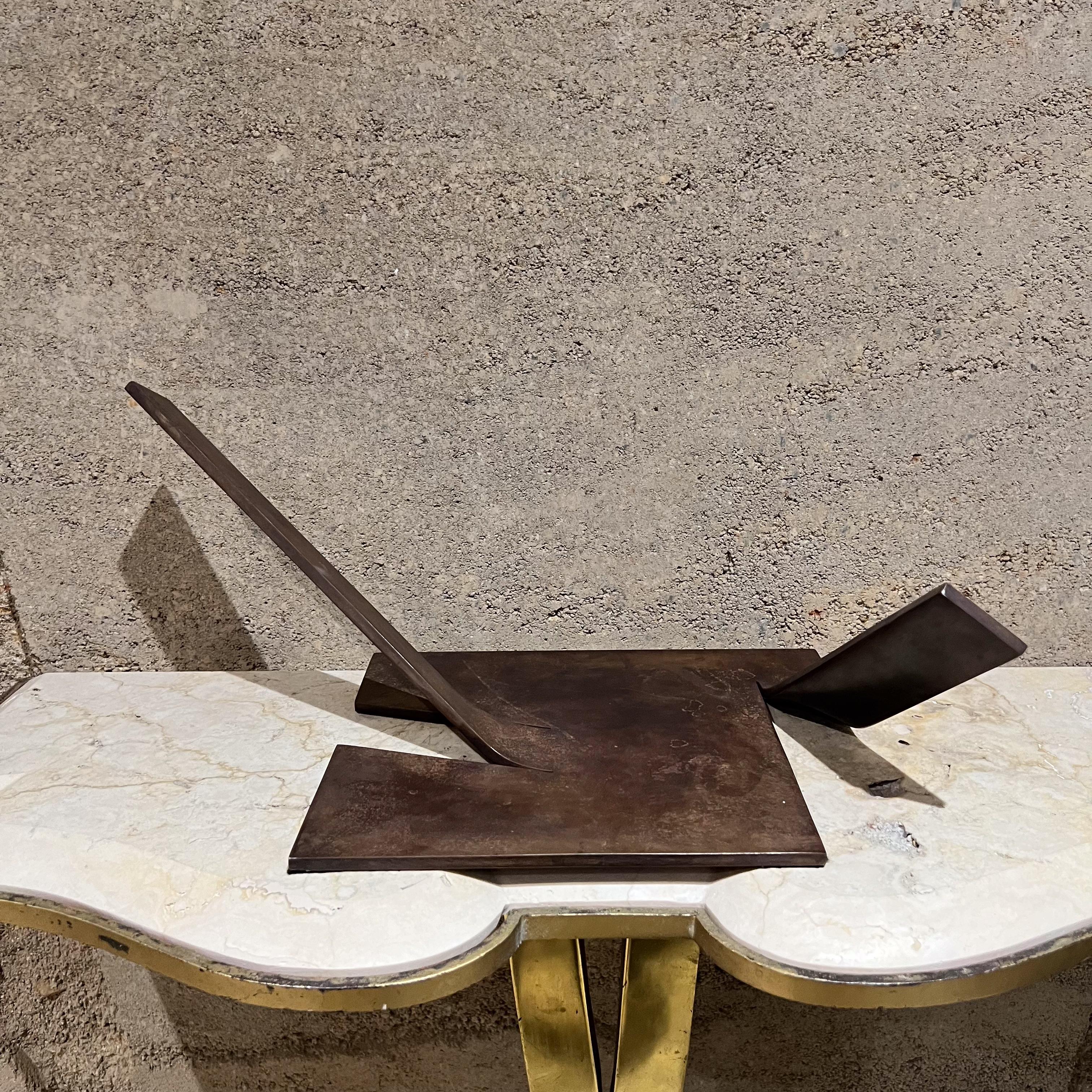 Abstract Bronze Sculpture
patinated bronze
stamped B.H.W. 3.81 (March 1981) 1.10 (1 of 10).
7.5 h x 18.5 w x 9 d
Sharp design sculpture can stand on one side resting on one of the corners of the bent bar and keep a 90-degree angle.
Dimensions and