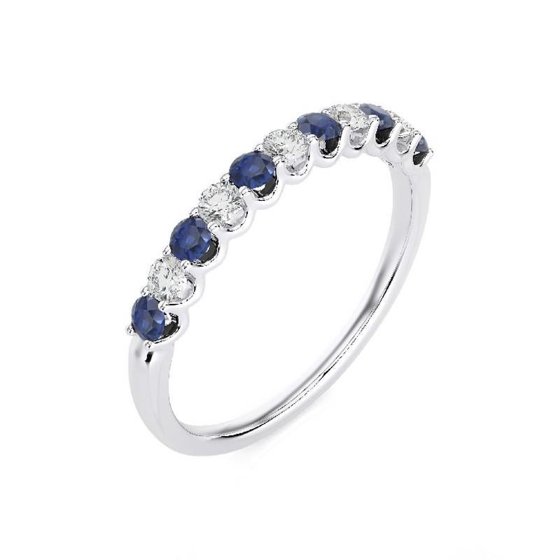 Gemstone Total Carat Weight: This exquisite 1981 Classic Collection ring features a total carat weight of 0.22 carats for 5 round diamonds and 0.35 carats for 6 round sapphires, creating a harmonious blend of sparkle and rich, deep blue hues.

Gold