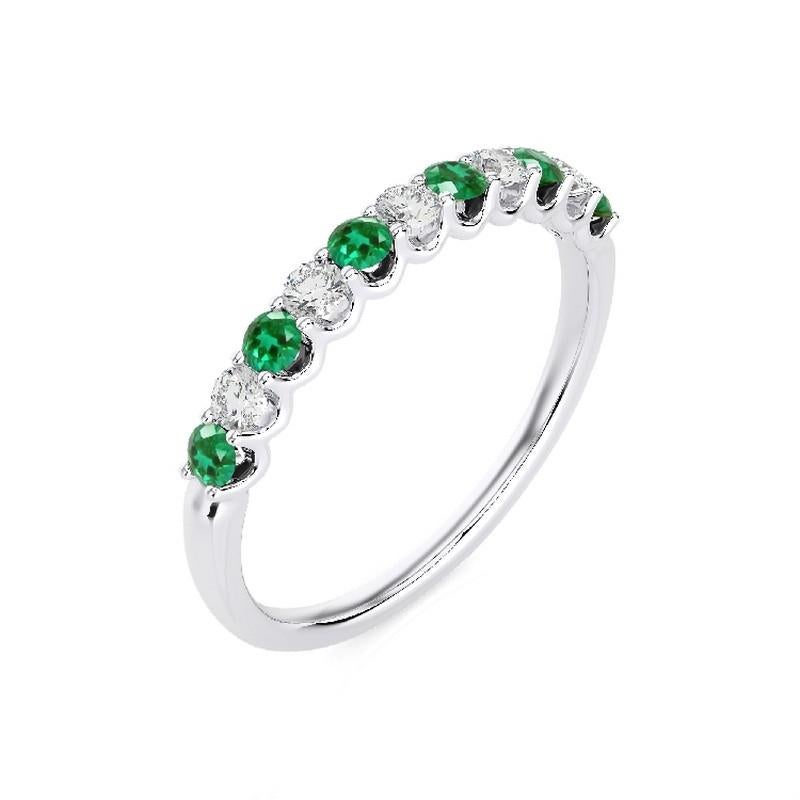 Gemstone Total Carat Weight: This exquisite 1981 Classic Collection ring features a total carat weight of 0.22 carats for 5 round diamonds and 0.35 carats for 6 round emeralds, creating a harmonious blend of sparkle and vibrant green hues.

Gold