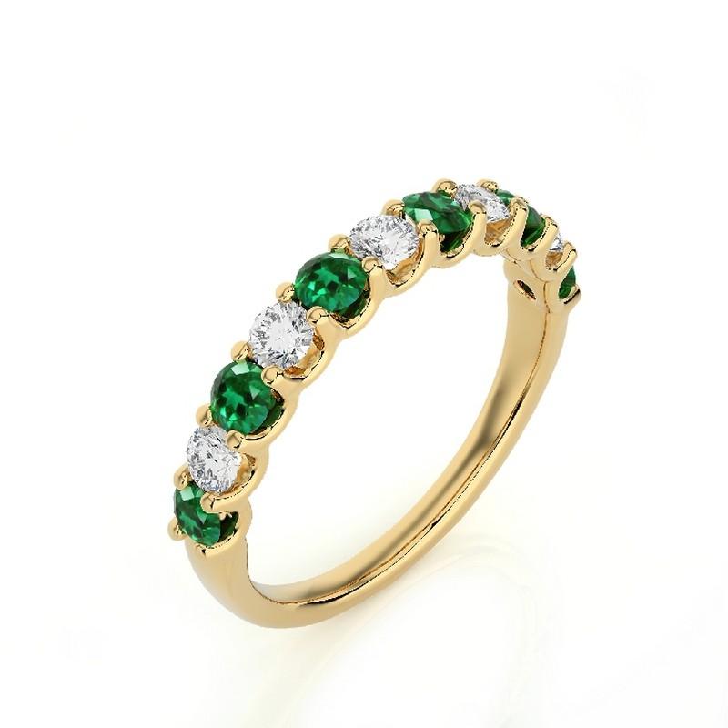 Gemstone Total Carat Weight: This exquisite 1981 Classic Collection wedding band ring features a total carat weight of 0.46 carats for 5 round diamonds and 0.5 carats for 6 round emeralds, creating a harmonious blend of sparkle and vibrant green