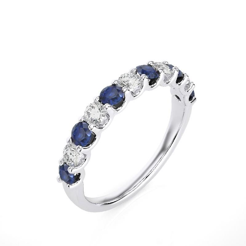 Gemstone Total Carat Weight: This exquisite 1981 Classic Collection wedding band ring features a total carat weight of 0.45 carats for 5 round diamonds and 0.7 carats for 6 round sapphires, creating a harmonious blend of sparkle and deep blue