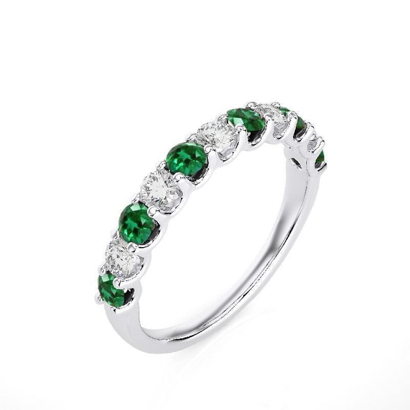 Gemstone Total Carat Weight: This exquisite 1981 Classic Collection wedding band ring features a total carat weight of 0.46 carats for 5 round diamonds and 0.5 carats for 6 round emeralds, creating a harmonious blend of sparkle and vibrant green