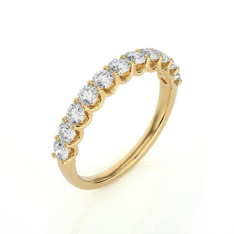 Diamond Total Carat Weight: This elegant 1981 Classic Collection wedding band ring features a total carat weight of 0.8 carats, showcasing 11 brilliant round diamonds that radiate exquisite sparkle and sophistication.

Gold Purity: Crafted with
