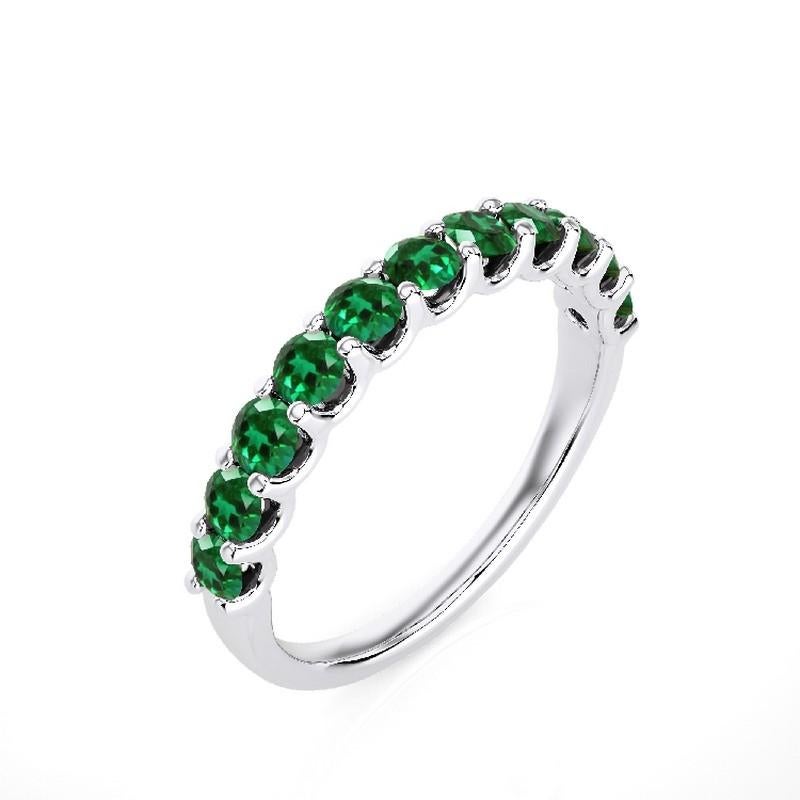 Emerald Total Carat Weight: This exquisite 1981 Classic Collection wedding ring features a total carat weight of 1.2 carats, showcasing 11 stunning round emeralds that radiate lush green hues and timeless beauty.

Gold Purity: Crafted with precision