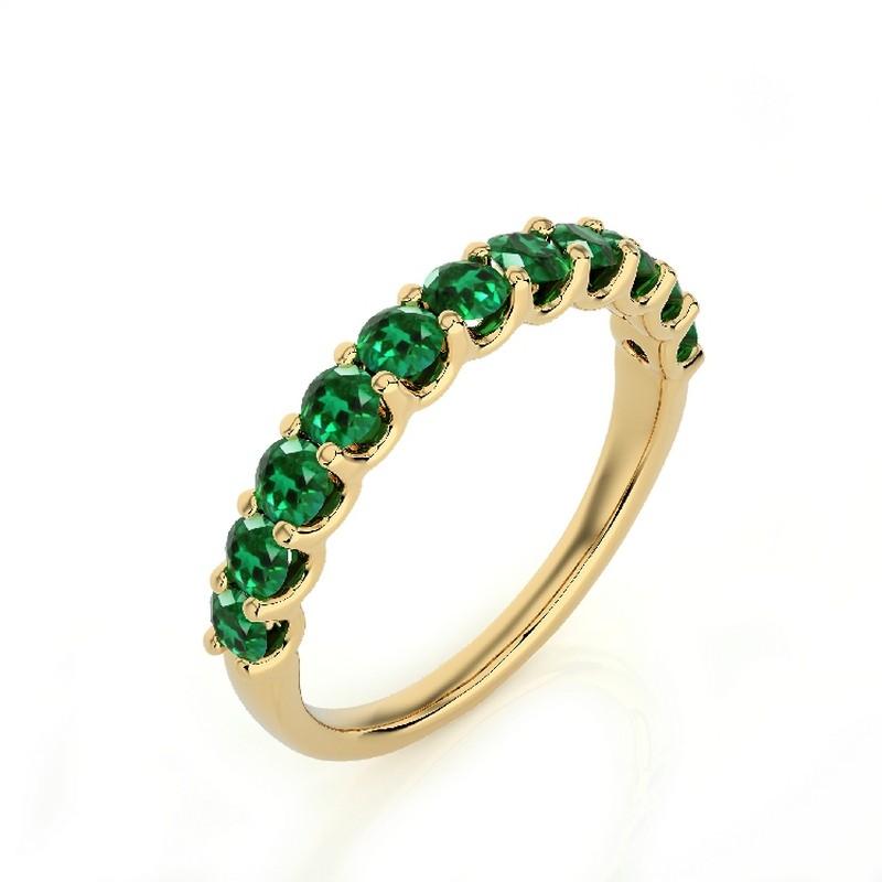 Emerald Total Carat Weight: This exquisite 1981 Classic Collection wedding ring features a total carat weight of 1.2 carats, showcasing 11 stunning round emeralds that radiate lush green hues and timeless beauty.

Gold Purity: Crafted with precision