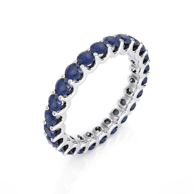 Sapphire Total Carat Weight: This exquisite 1981 Classic Collection wedding ring features a total carat weight of 2.75 carats, showcasing 25 stunning round sapphires that radiate deep blue hues and timeless beauty.

Gold Purity: Crafted with