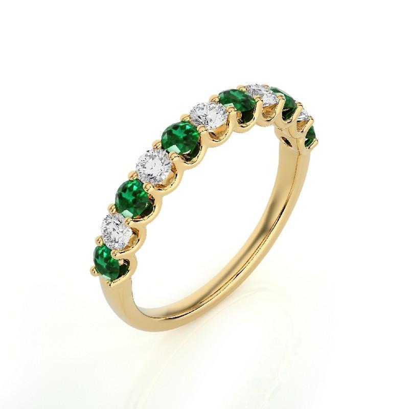Gemstone Total Carat Weight: This exquisite 1981 Classic Collection wedding band ring features a total carat weight of 0.33 carats for 5 round diamonds and 0.5 carats for 6 round emeralds, creating a harmonious blend of sparkle and vibrant green