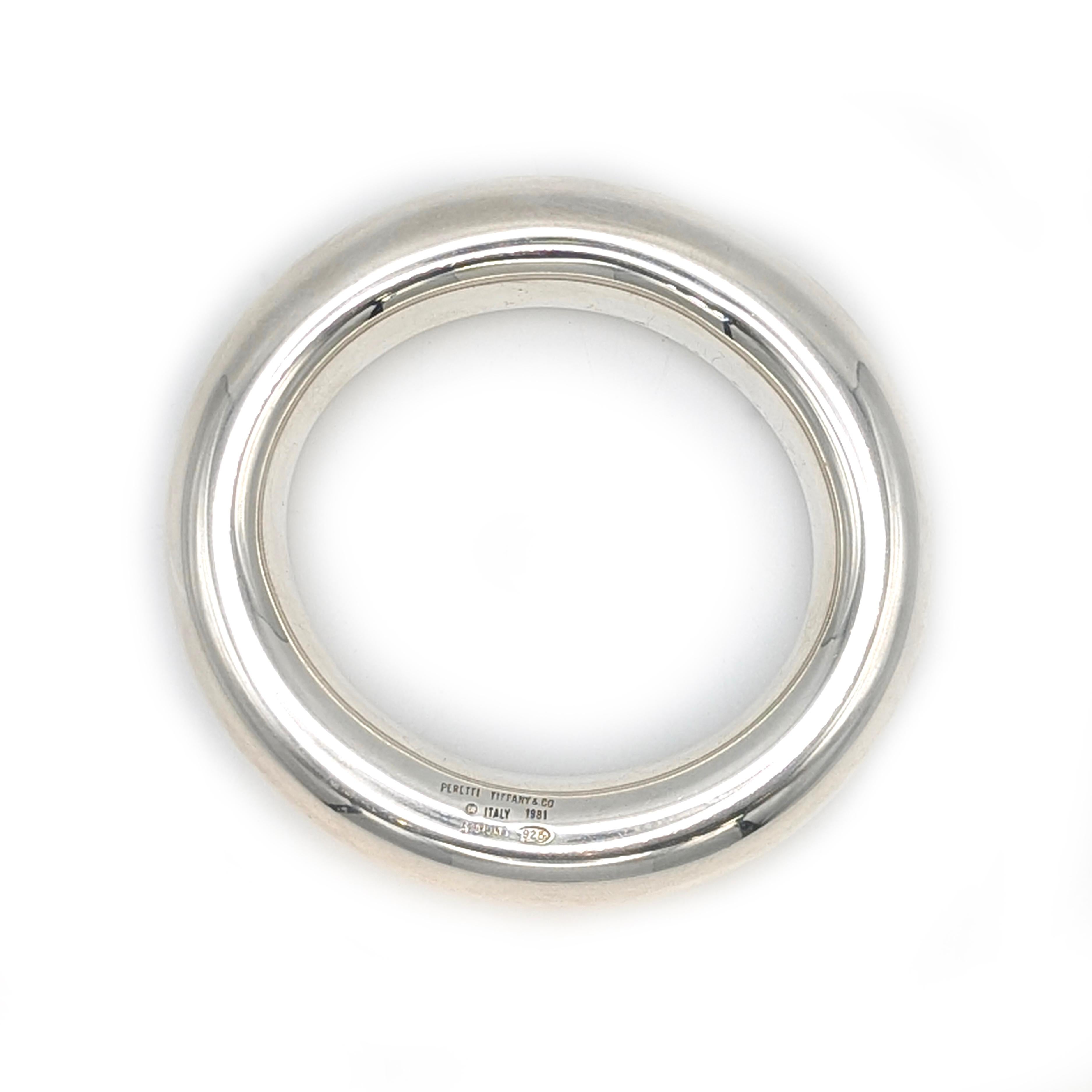 Stunning Tiffany & Co Elsa Peretti sterling doughnut bangle from 1981. Bangle is a slight oval shape, in large size that fits wrists up to 7.75
