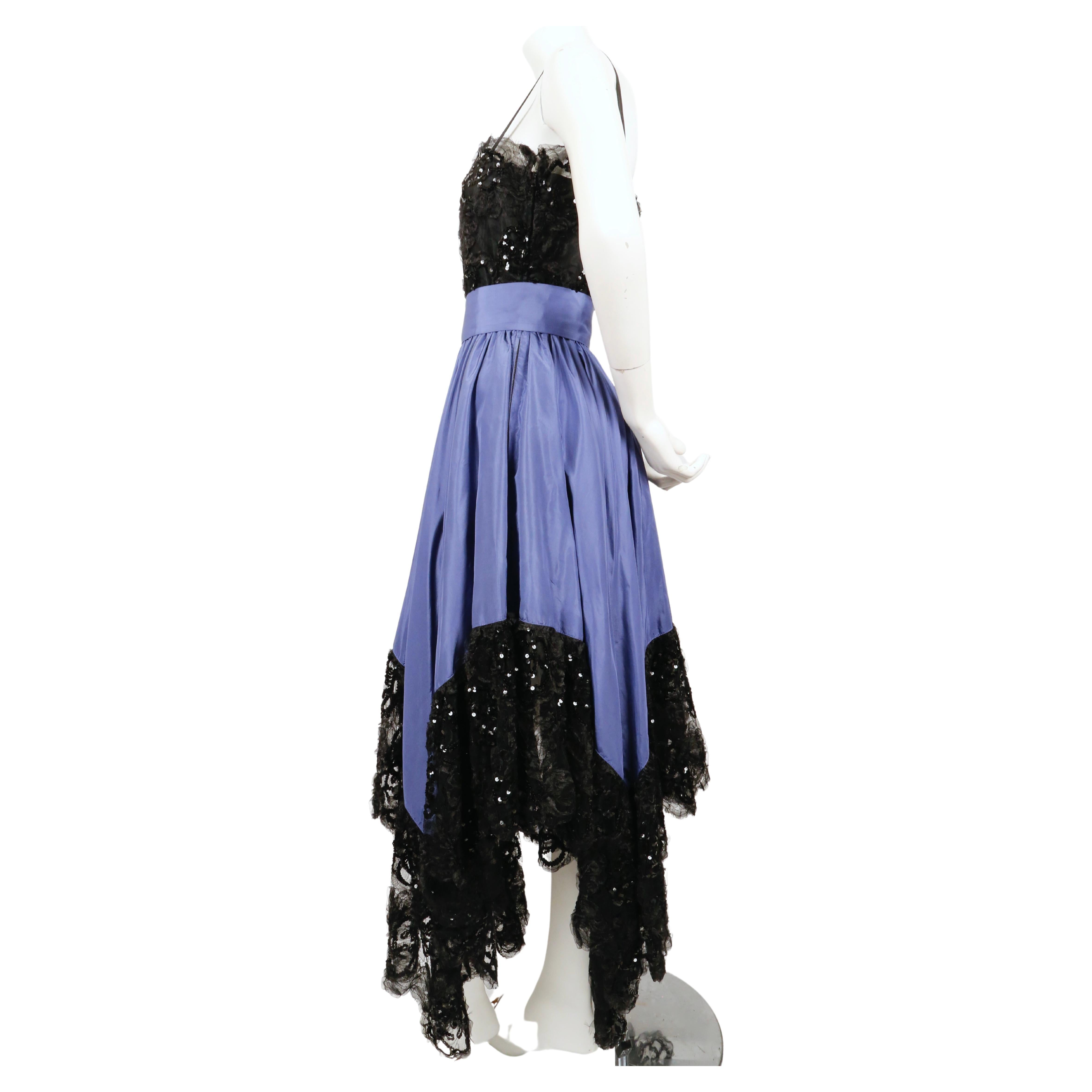 Black lace and periwinkle silk taffeta gown with sequins and handkerchief hemline designed by Yves Saint Laurent dating to fall of 1981 exactly as seen on the runway. Labeled a French size 40 however this fits small. Approximate measurements: bust