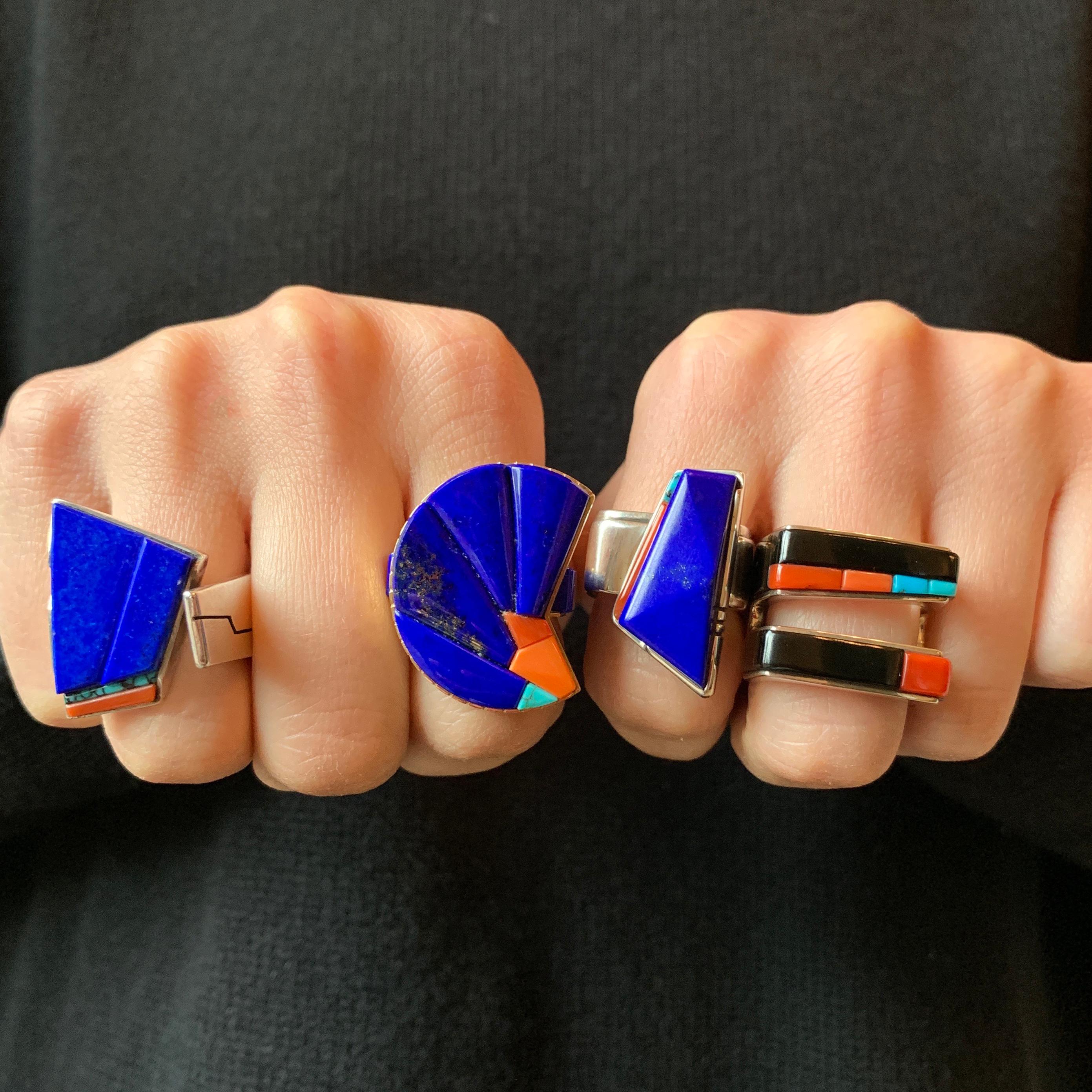 A carved lapis lazuli, coral, turquoise, and sterling silver ring, by master goldsmith & lapidary, San Felipe Pueblo, Richard Chavez, 1982. This ring is a size 7 and it is stamped with makers mark. Due to the nature of this design, this ring can be