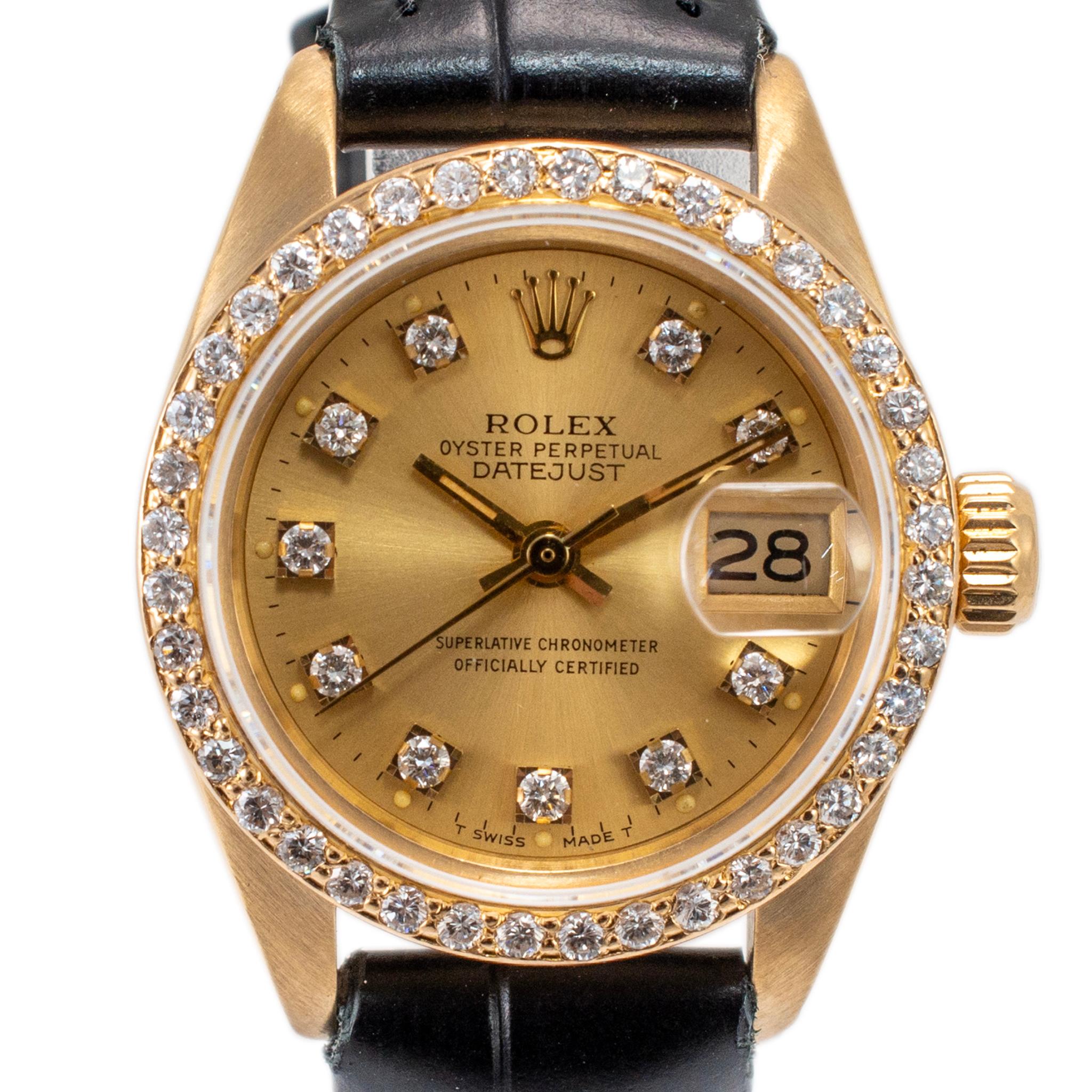 Brand: Rolex

Gender: Ladies

Metal Type: 18K Yellow Gold

Diameter: 26.00 mm

Weight: 29.47 grams

One ladies 18K yellow gold diamond ROLEX Swiss-made watch. The metal was tested and determined to be 18K yellow gold. The 