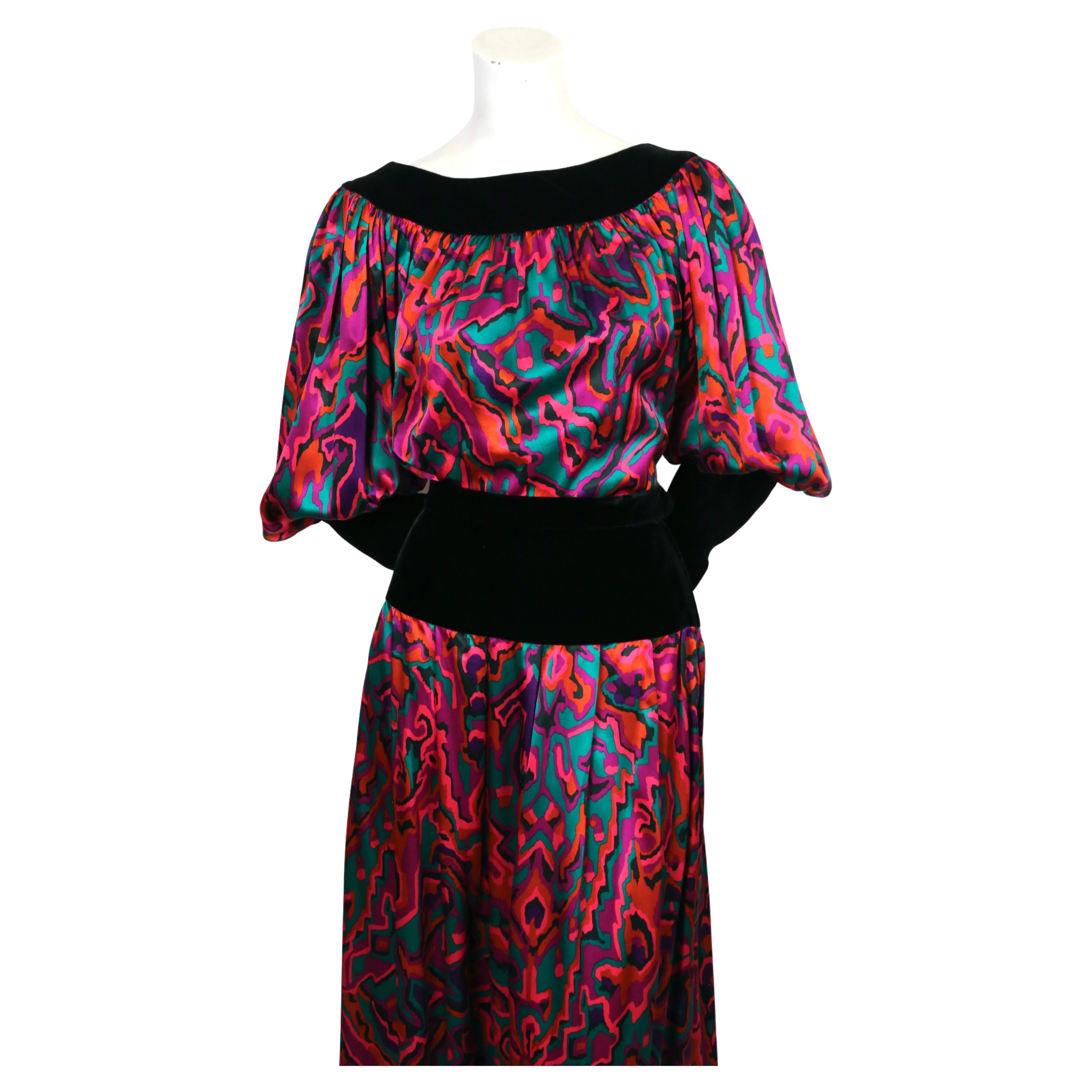 Abstract printed silk top and matching skirt trimmed in black velvet from Yves Saint Laurent dating to fall of 1982 exactly as seen on the runway. Also great worn as separates. Top is labeled a FR 40 and skirt is unlabeled. Approximate measurements