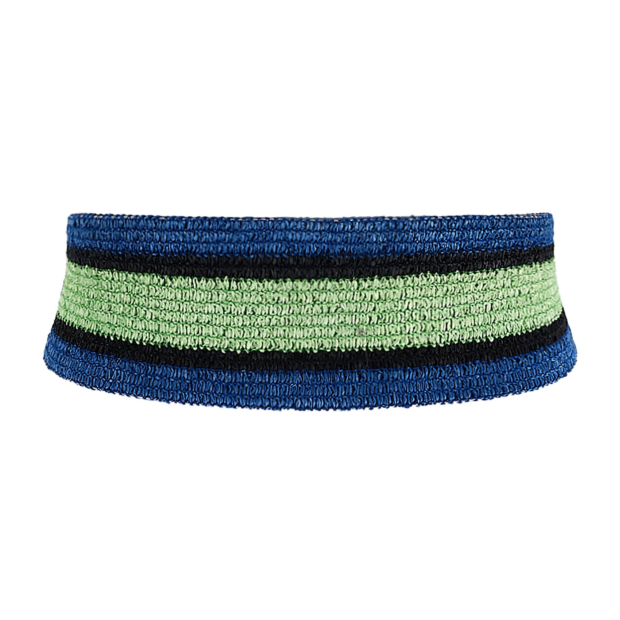 This documented vintage belt was designed by Yves Saint Laurent and walked the runway as part of the brand’s Spring 1982 collection. It is elasticated and woven from raffia in stripes of blue, black and pale mint green. The stitching coordinates