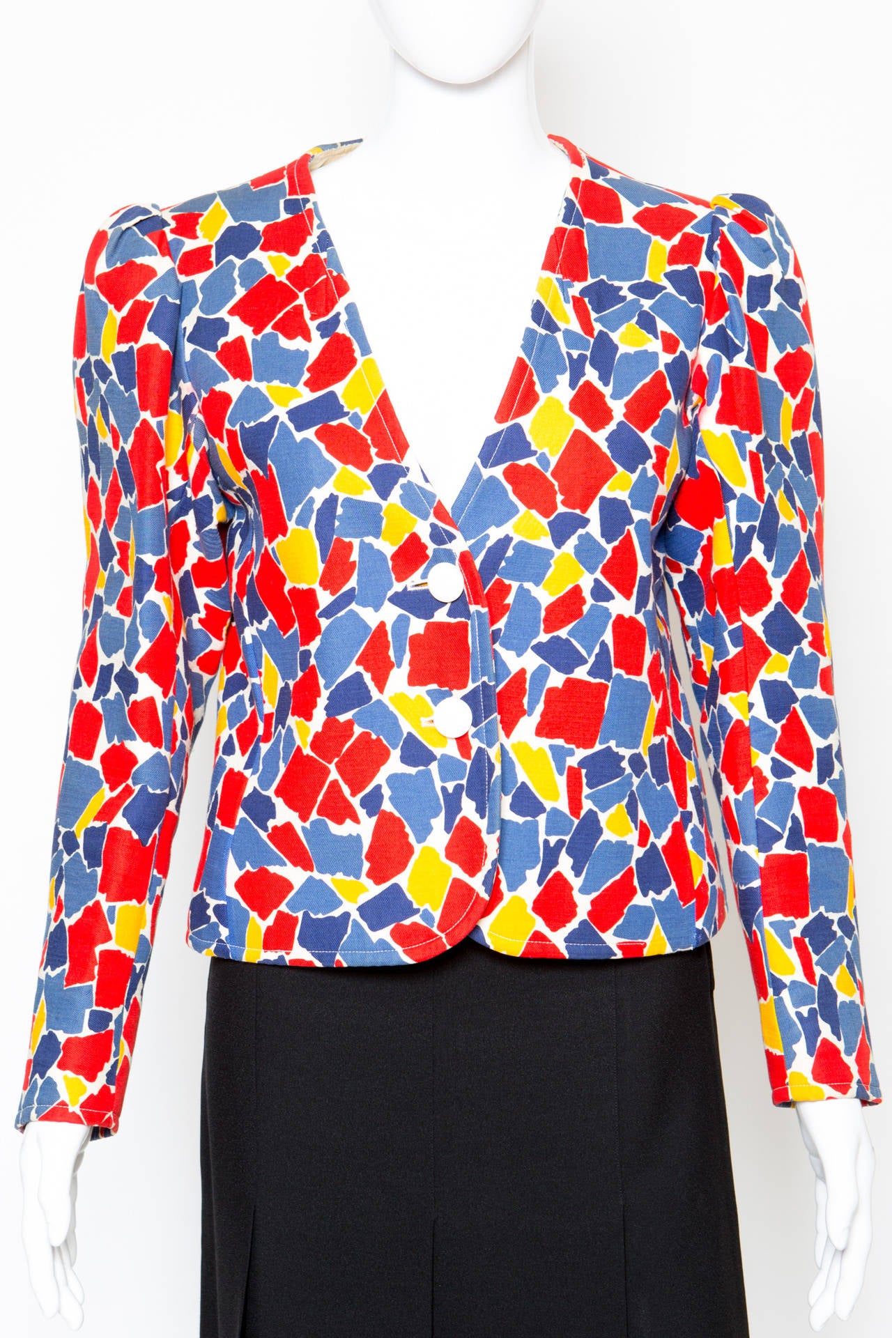 1980s Yves Saint Laurent YSL multico printed jacket featuring a geometric yellow, blue & red geometric pattern in a heavy wool fabric, fancy pleats at sleeves, deep 