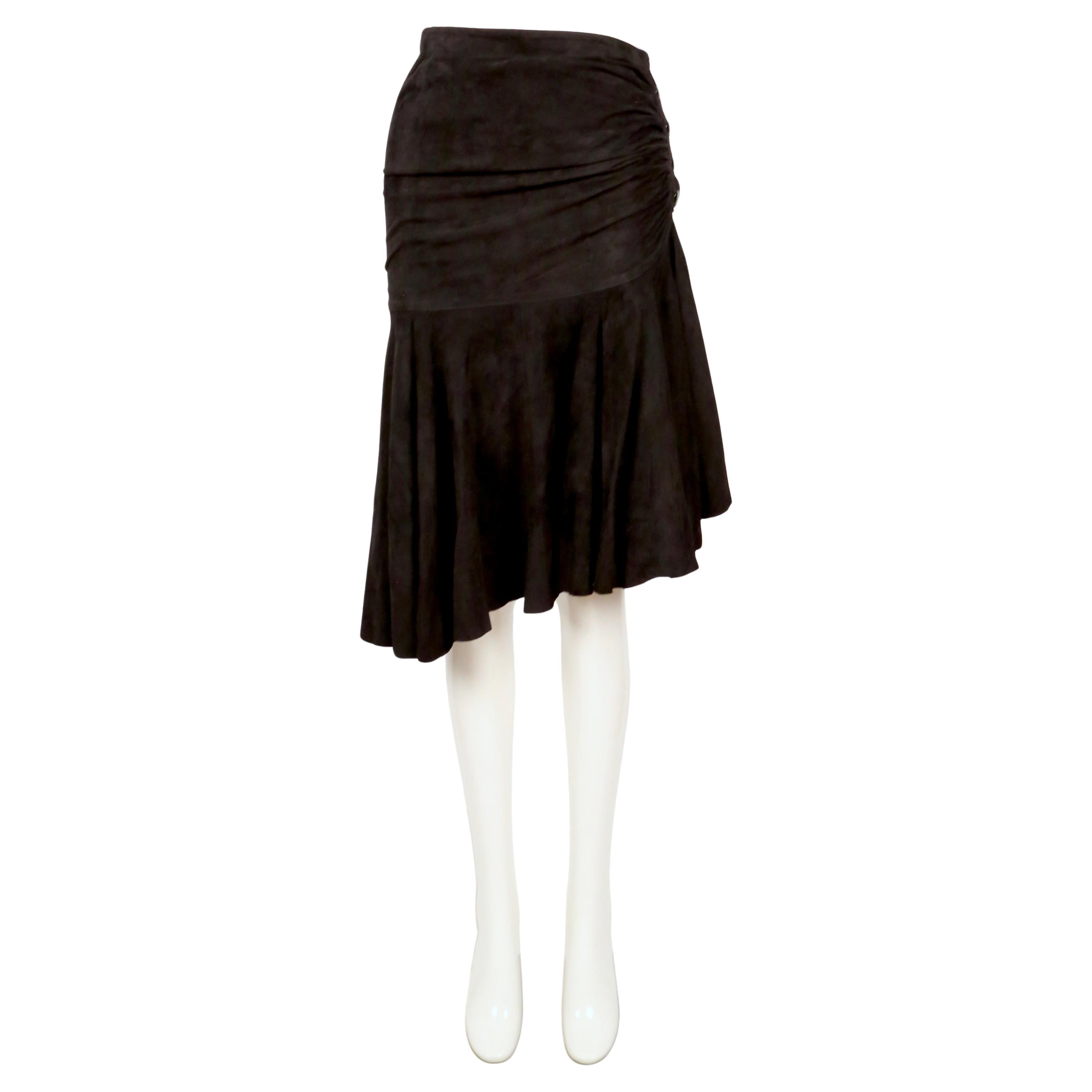 Jet black suede skirt with ruching and side snap closure from Azzedine Alaia dating to 1983. Labeled a French size 38. Skirt best fits a size 2 or 4. Approximate measurements: waist 24-25