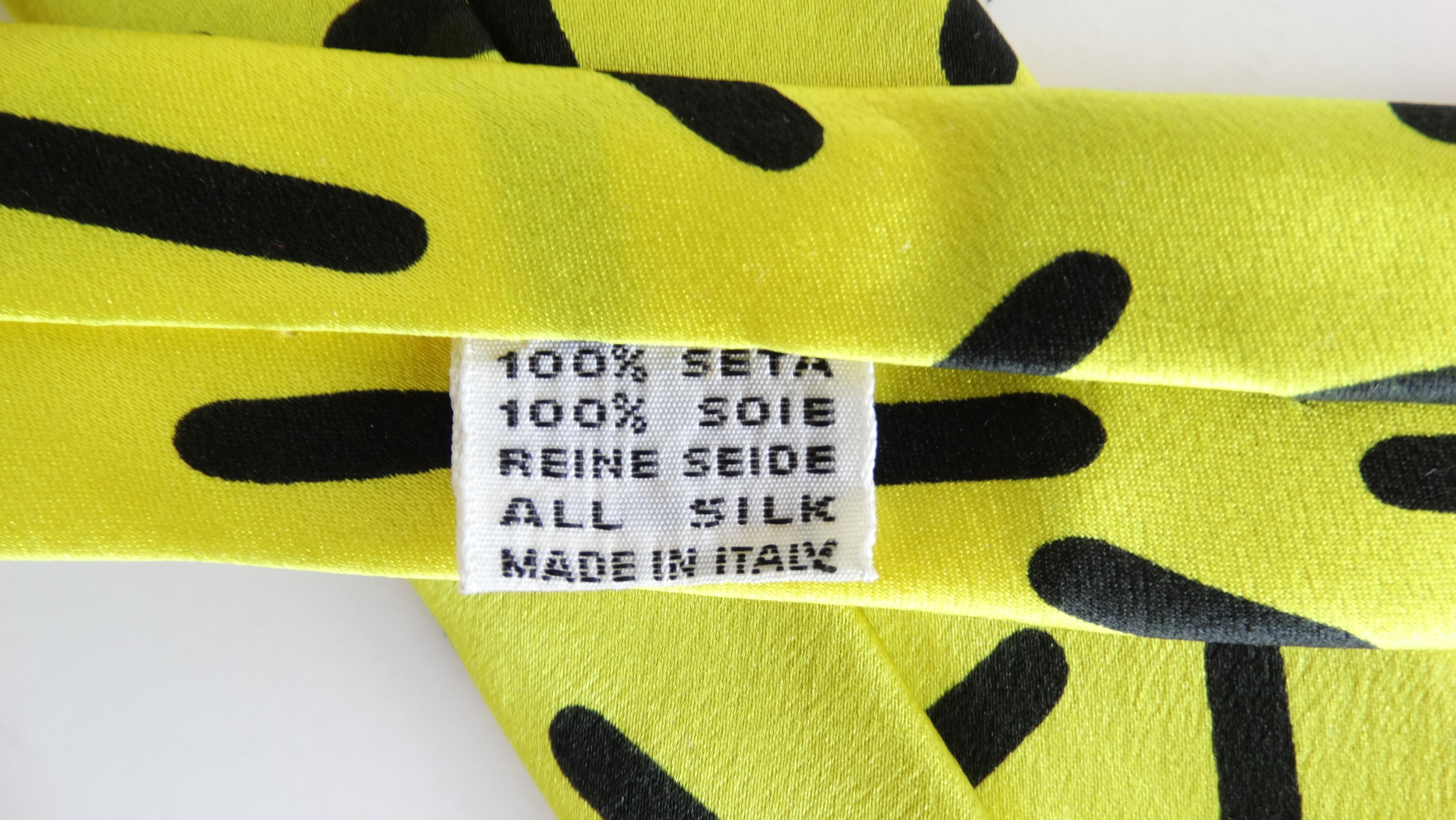 Elevate your look with this amazing Memphis Milano tie! Circa 1983, this Silk tie features a geometric design created by Memphis Milano member and creator, Ettore Sottsass. Comprised of black bullet shapes against a bright yellow background, this