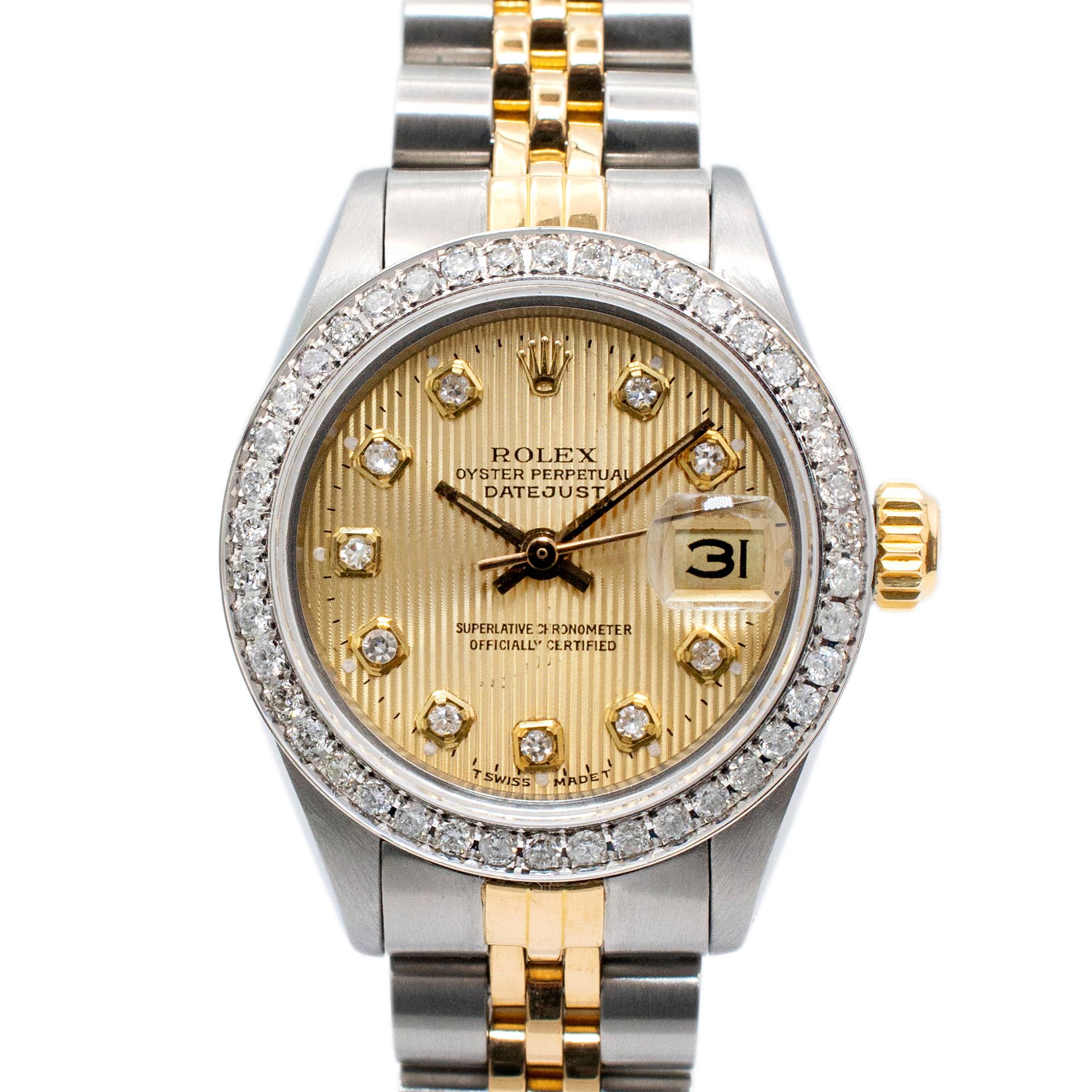 Gender: Ladies

Metal Type: 18K Yellow Gold and Stainless steel

Diameter: 26.00 mm

Weight: 52.00 grams

One ladies 18K yellow gold and stainless steel, diamond ROLEX Swiss made watch. The metals were tested and determined to be 18K yellow gold and