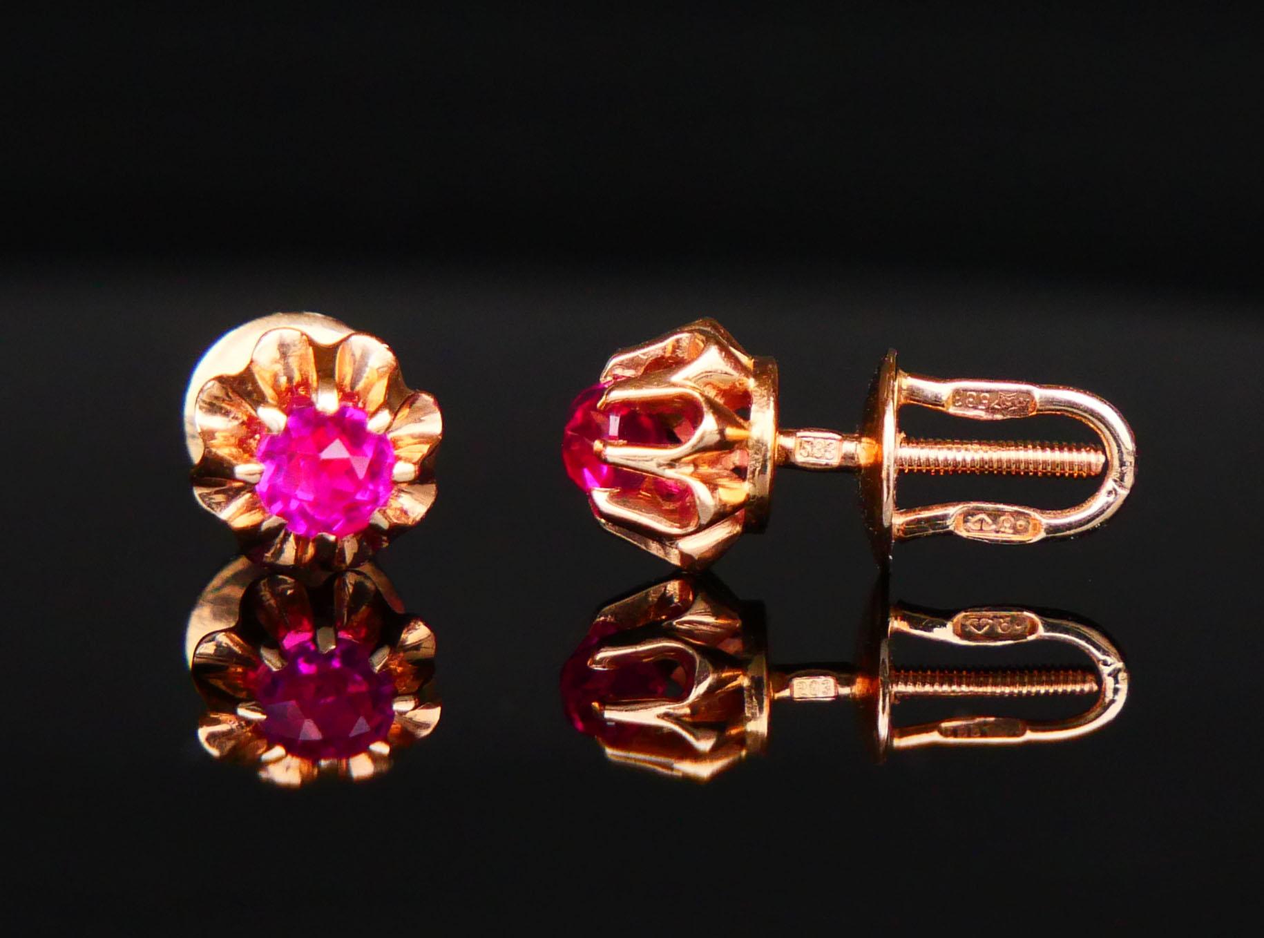 A pair of Soviet studs in solid 14K Rose Gold decorated with claw set diamond cut lab made Red Ruby stones. Intricate extra secure screw mechanism provides secure and perfect fit.

Soviet period standard hallmarks with hammer and sickle pentagram