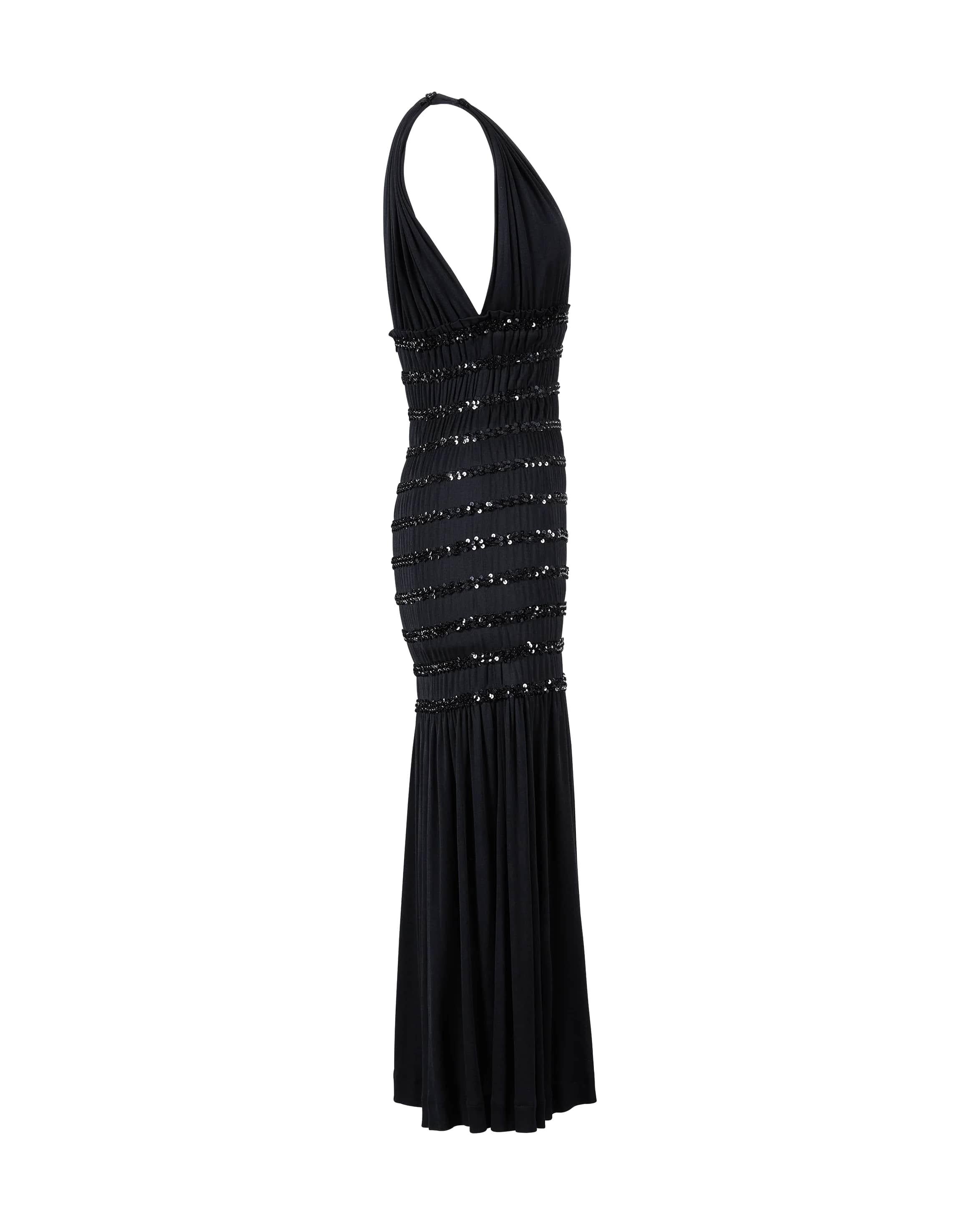1983 Yves Saint Laurent Rive Gauche black jersey sequin midi dress. Sleeveless black dress with sequin details across ruched waist through hip. Moderate stretch throughout. 
