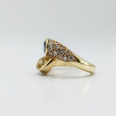 1984 18K Gold Blue and Yellow Sapphire Diamond Bypass Ring