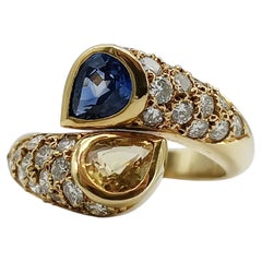 1984 18K Gold Blue and Yellow Sapphire Diamond Bypass Ring