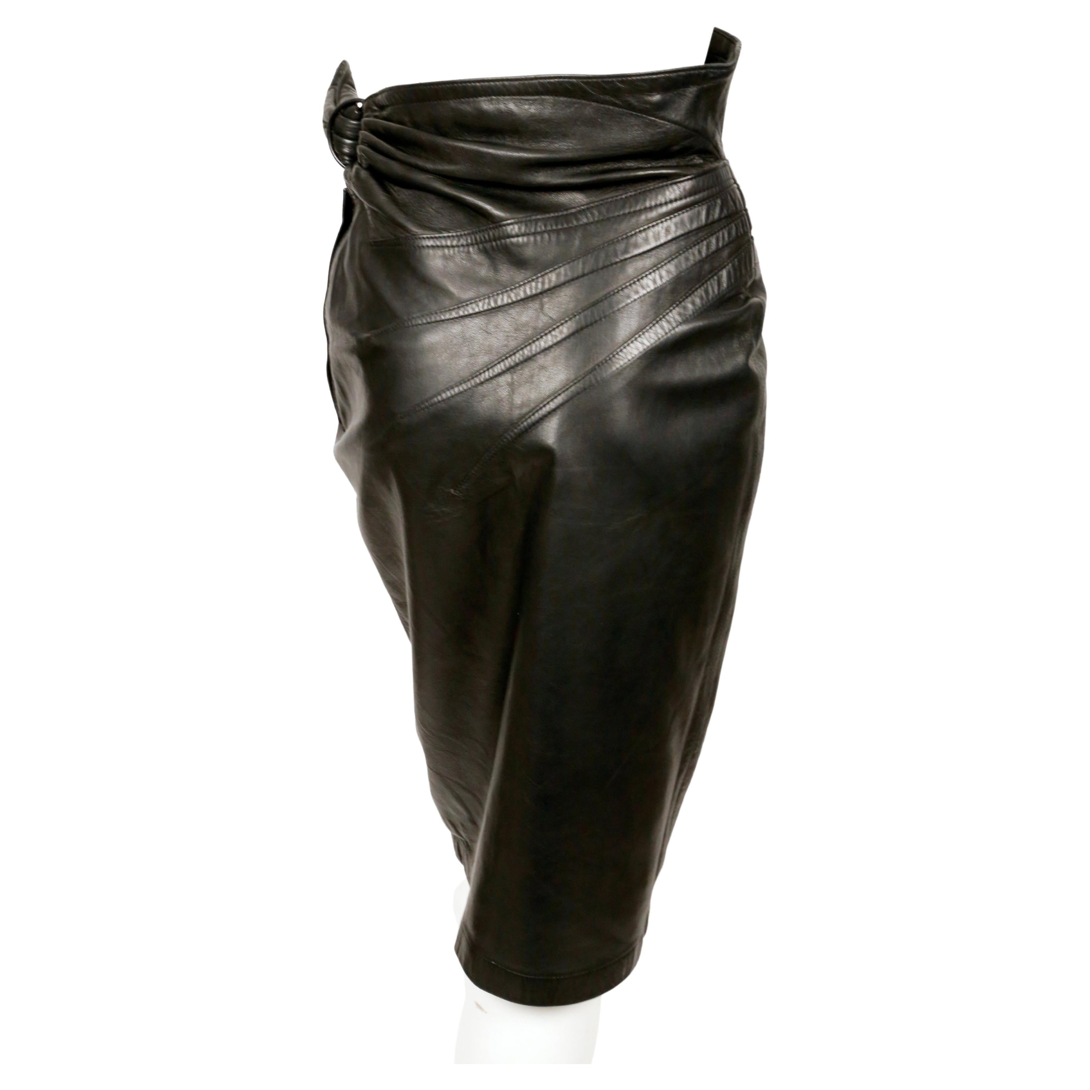 Women's or Men's 1984 AZZEDINE ALAIA black leather skirt with side buckle