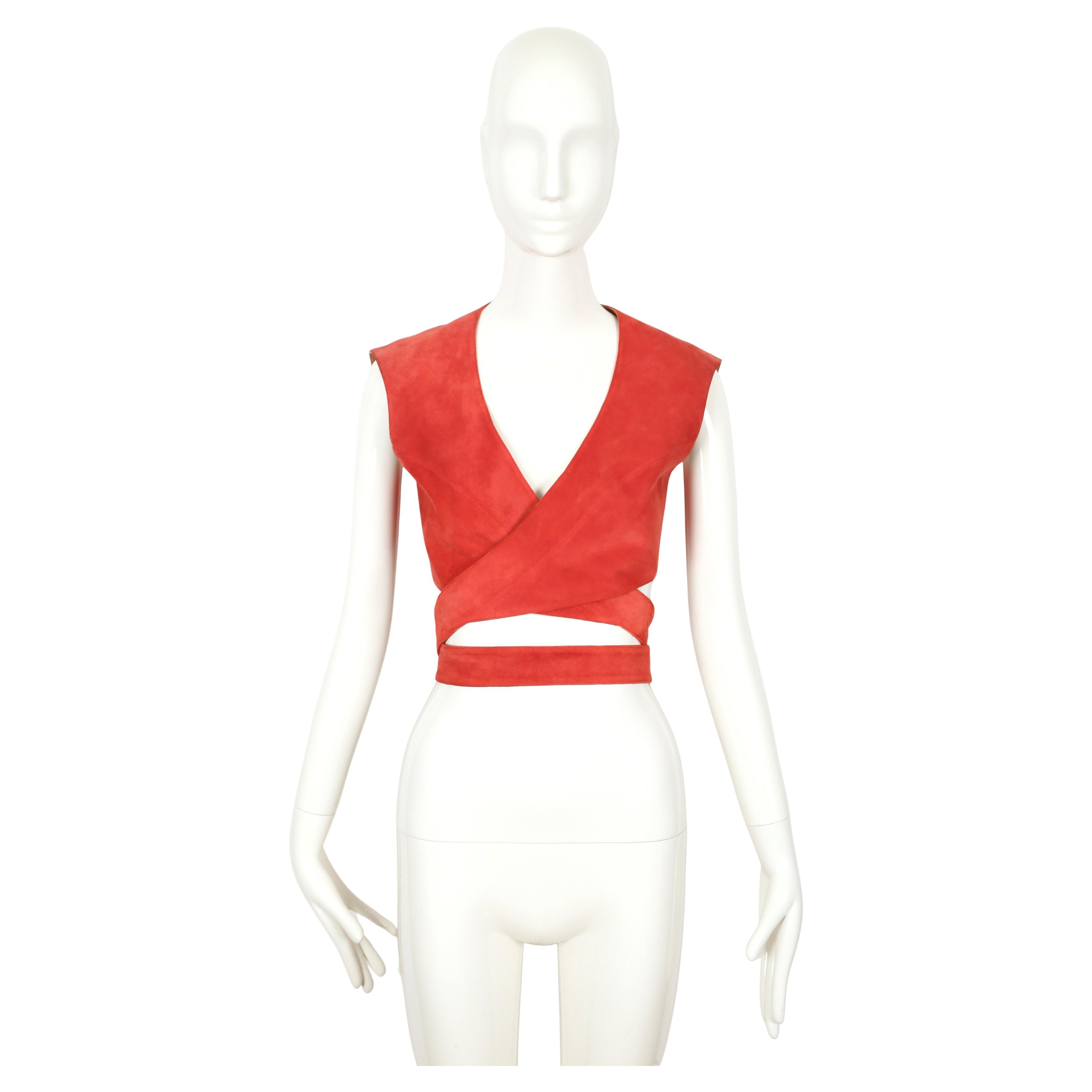 Very rare, deep salmon-red suede wrap top designed by Azzedine Alaia dating to 1983. I have included a photo of the top in leather from 1982. Looks great worn as a top or layered over something else. Labeled a French size 38 and best fits an XS or