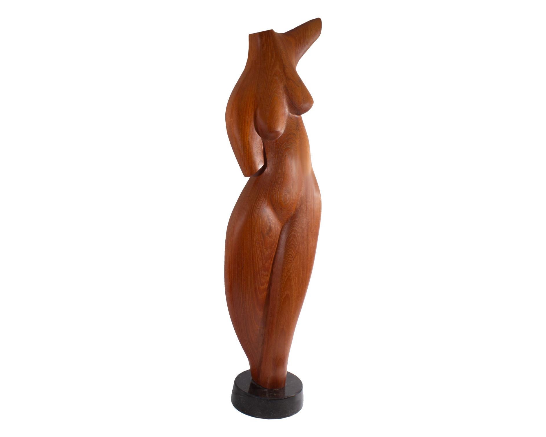 wooden dog and woman sculpture